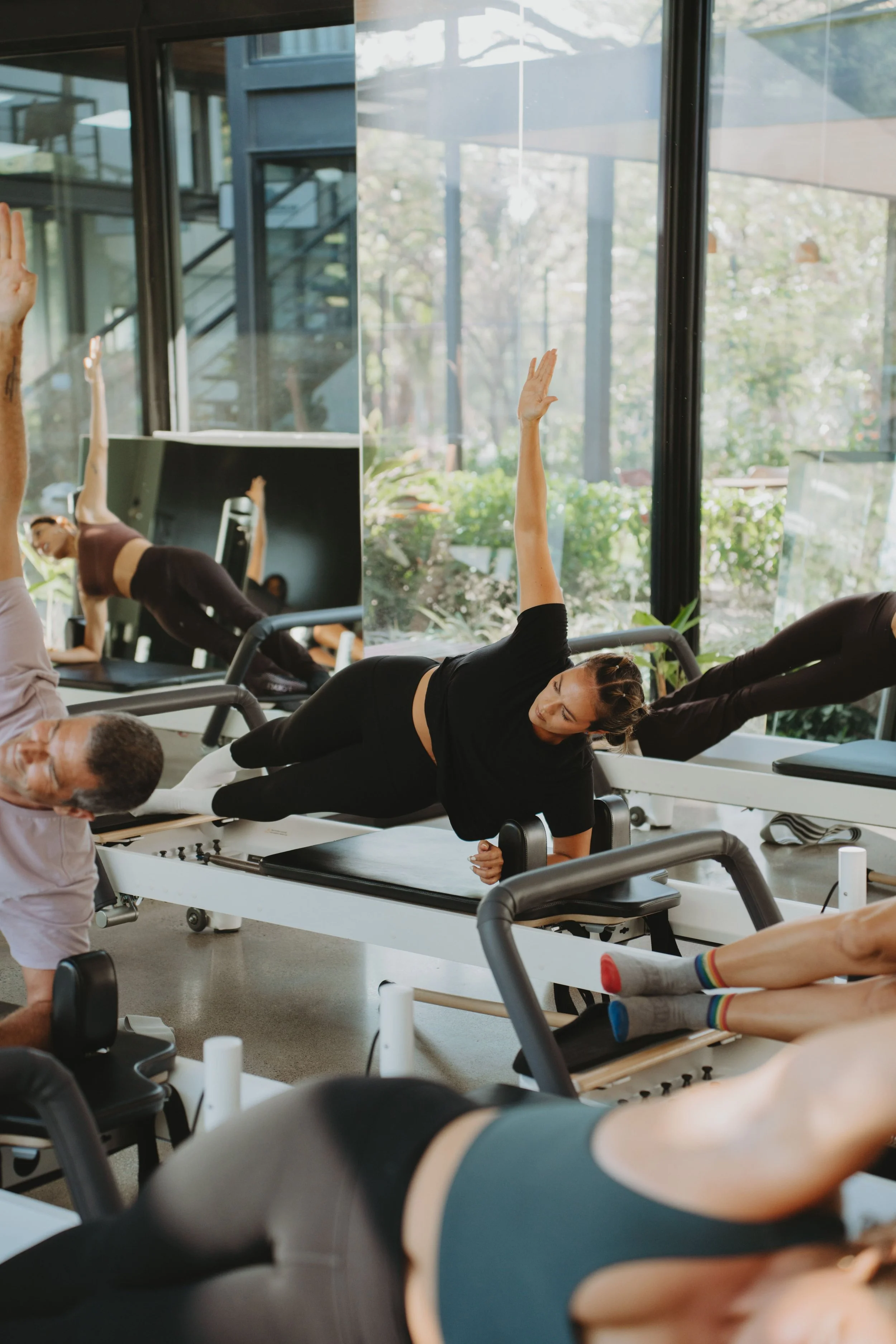 Instructor cueing a client on the reformer at Black Cat Studio, Nosara
