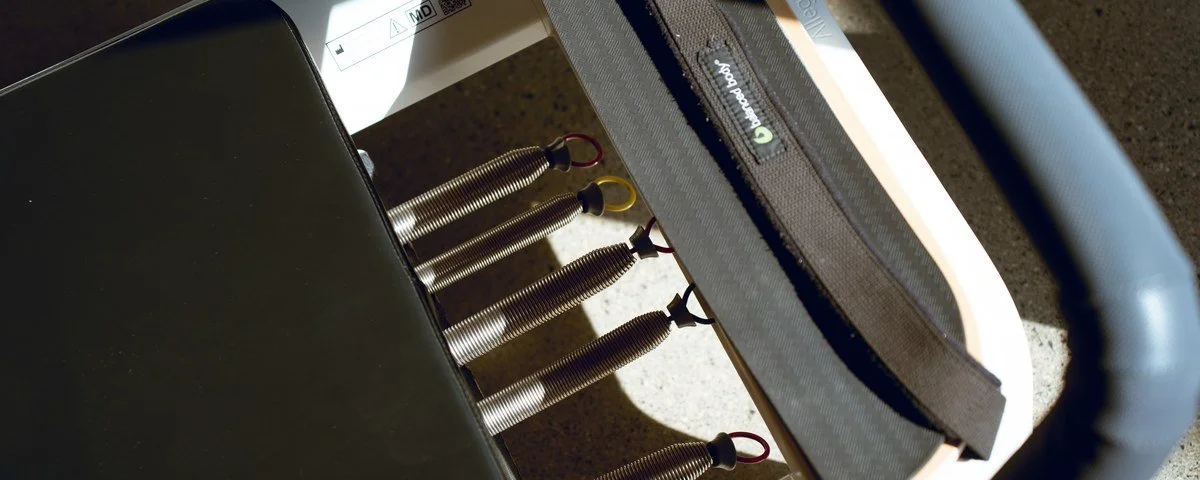 Close view of a reformer carriage and springs