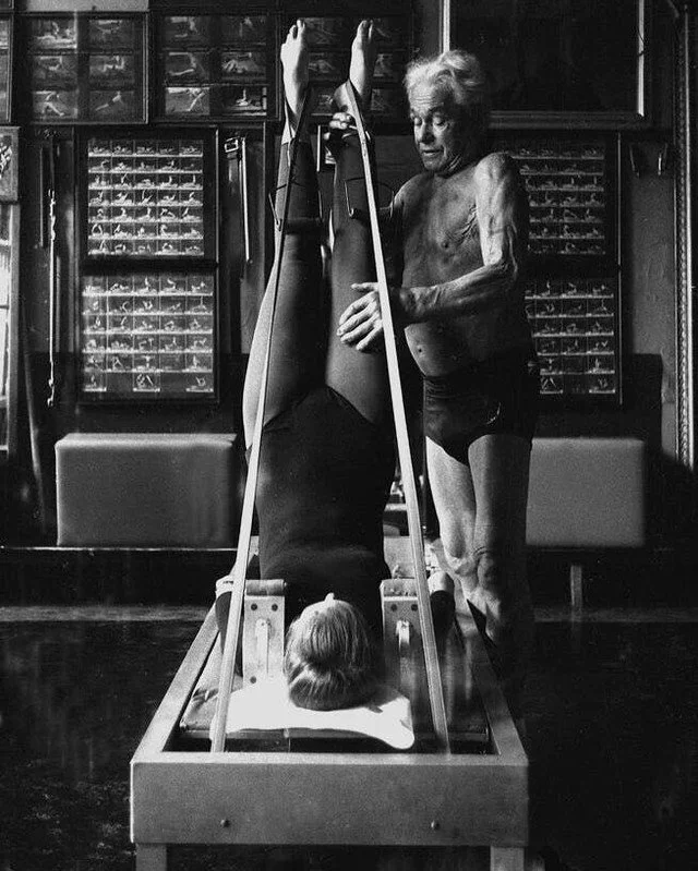 Happy International Pilates Day to Joseph Pilates, who invented this entire torture method over a century ago using literal bedsprings and spite. The man was imprisoned during WWI and decided 'might as well create a whole fitness movement.' Respect. 