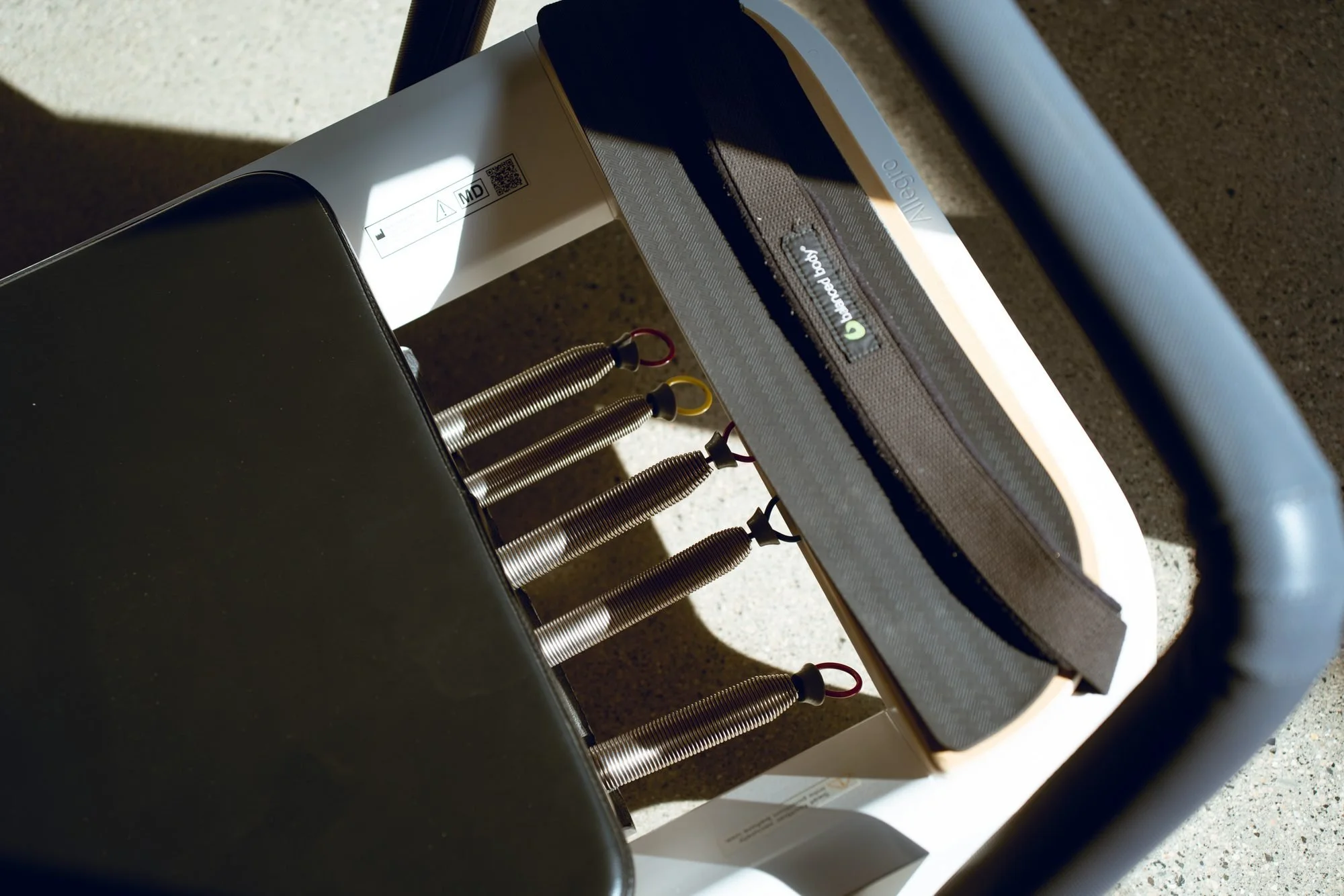 Close-up of the resistance springs on a Pilates reformer