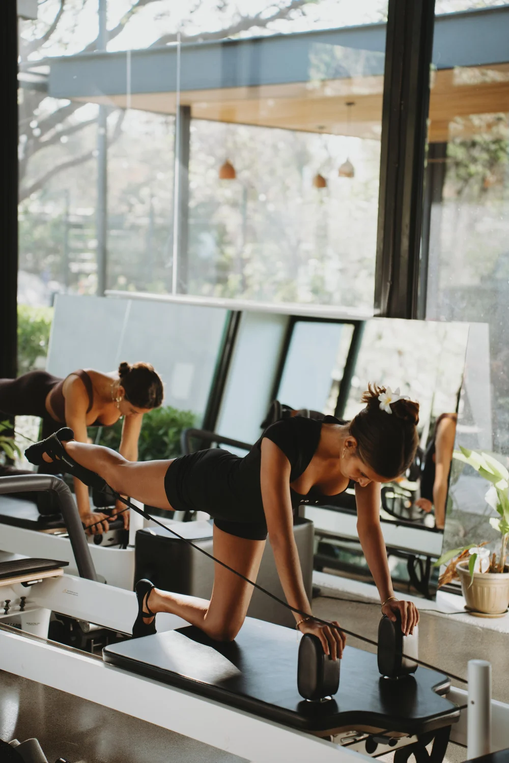 Beginner working through fundamentals on the reformer at Black Cat Studio, Nosara