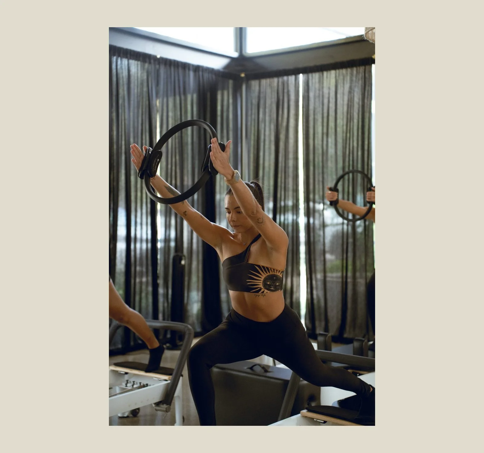 Woman doing a reformer Pilates exercise with a Pilates ring at Black Cat Studio in Nosara
