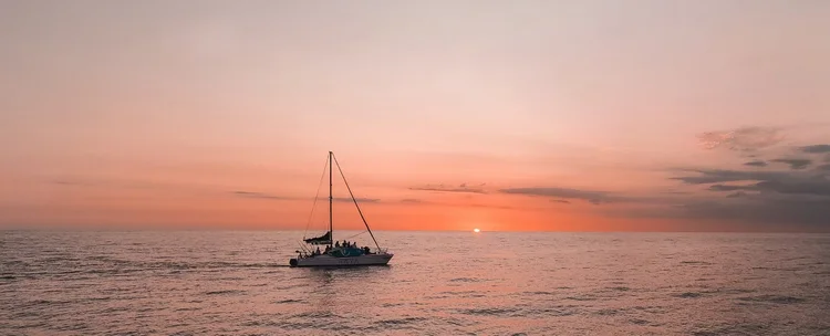 Sunset catamaran tour in Nosara, Costa Rica — Black Cat Studio Pilates retreat