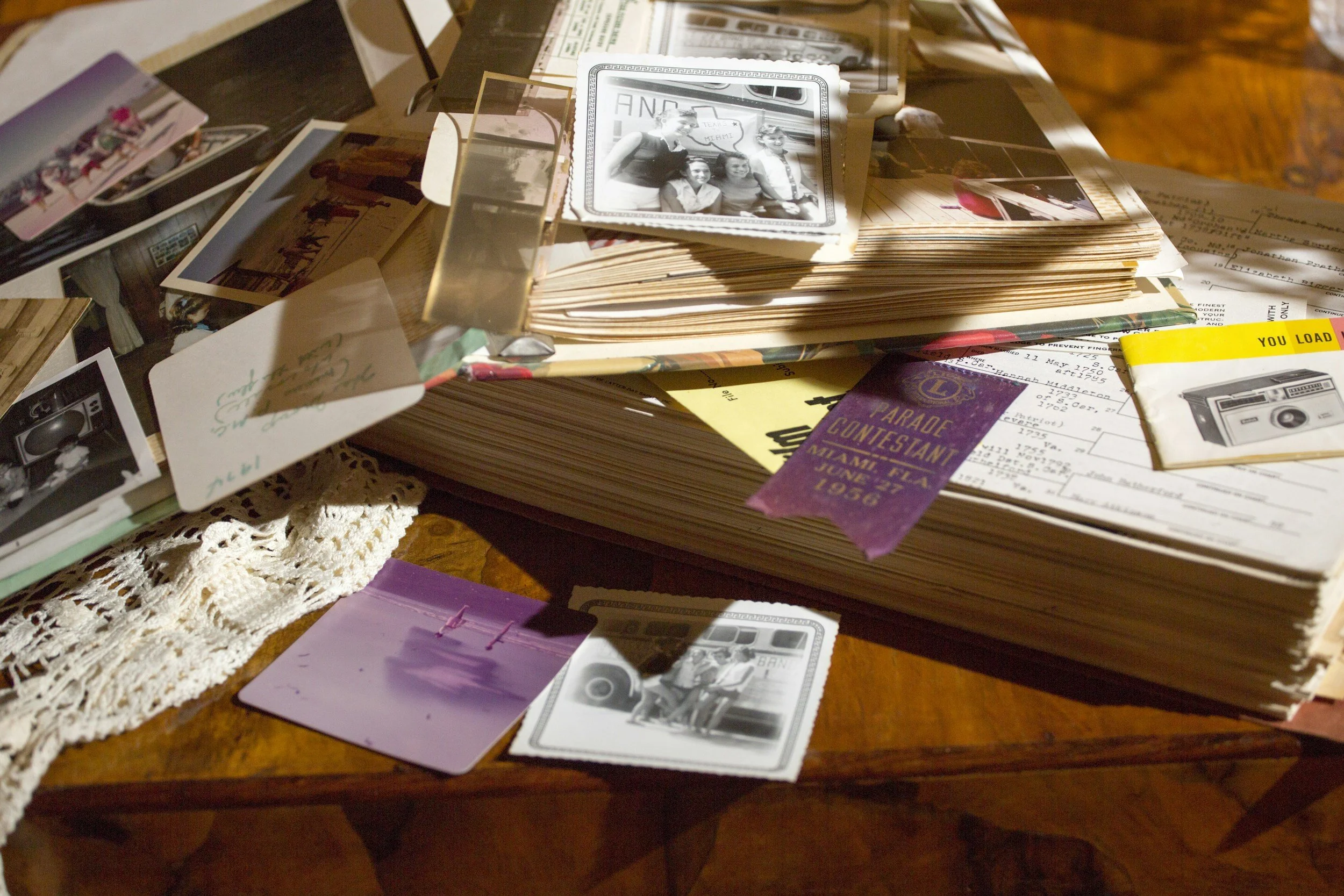 Keepsake box and old family photographs representing cherished memories during a senior transition