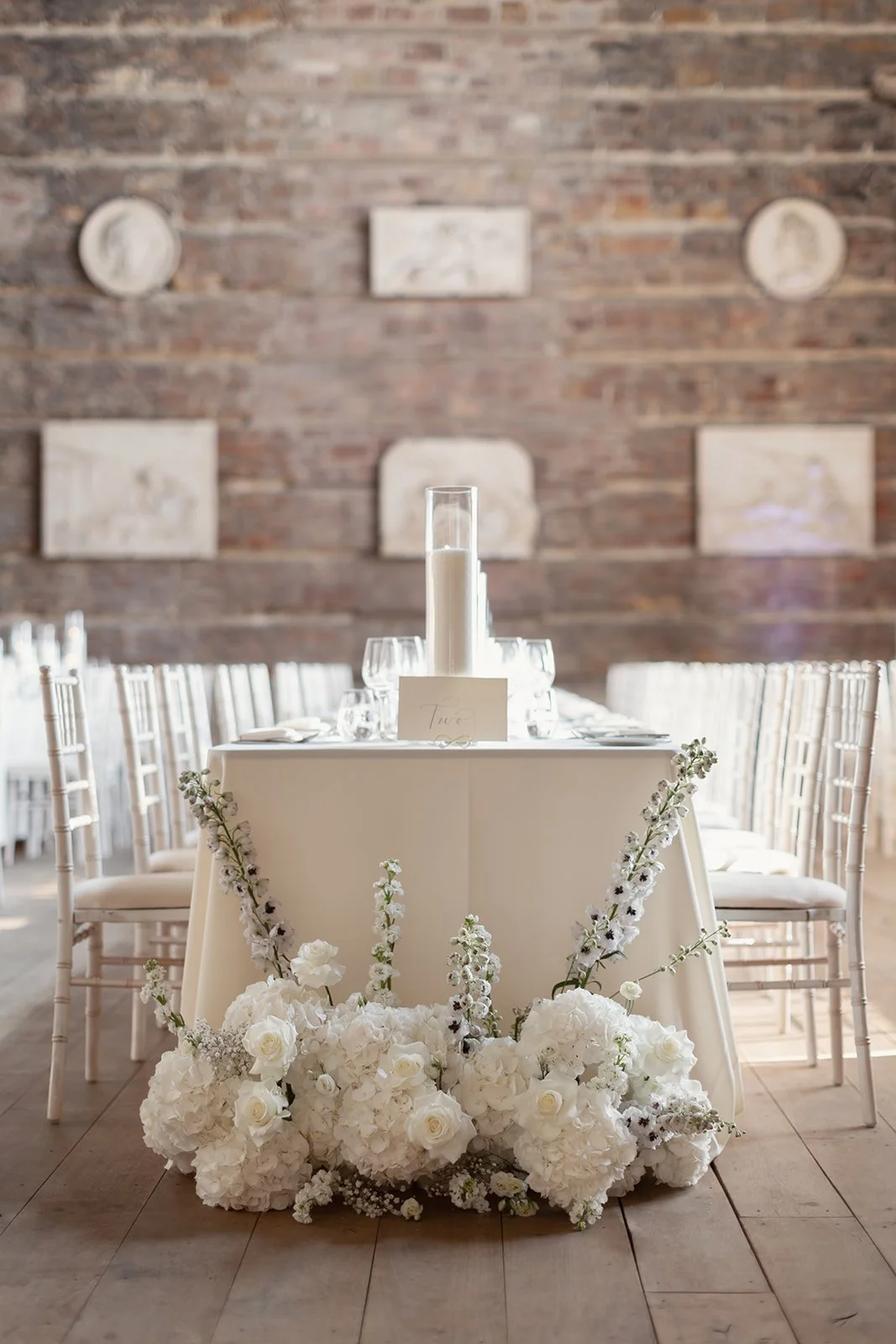 wedding-breakfast-floral-arrangement-and-candle-decor-gosford-house.jpg