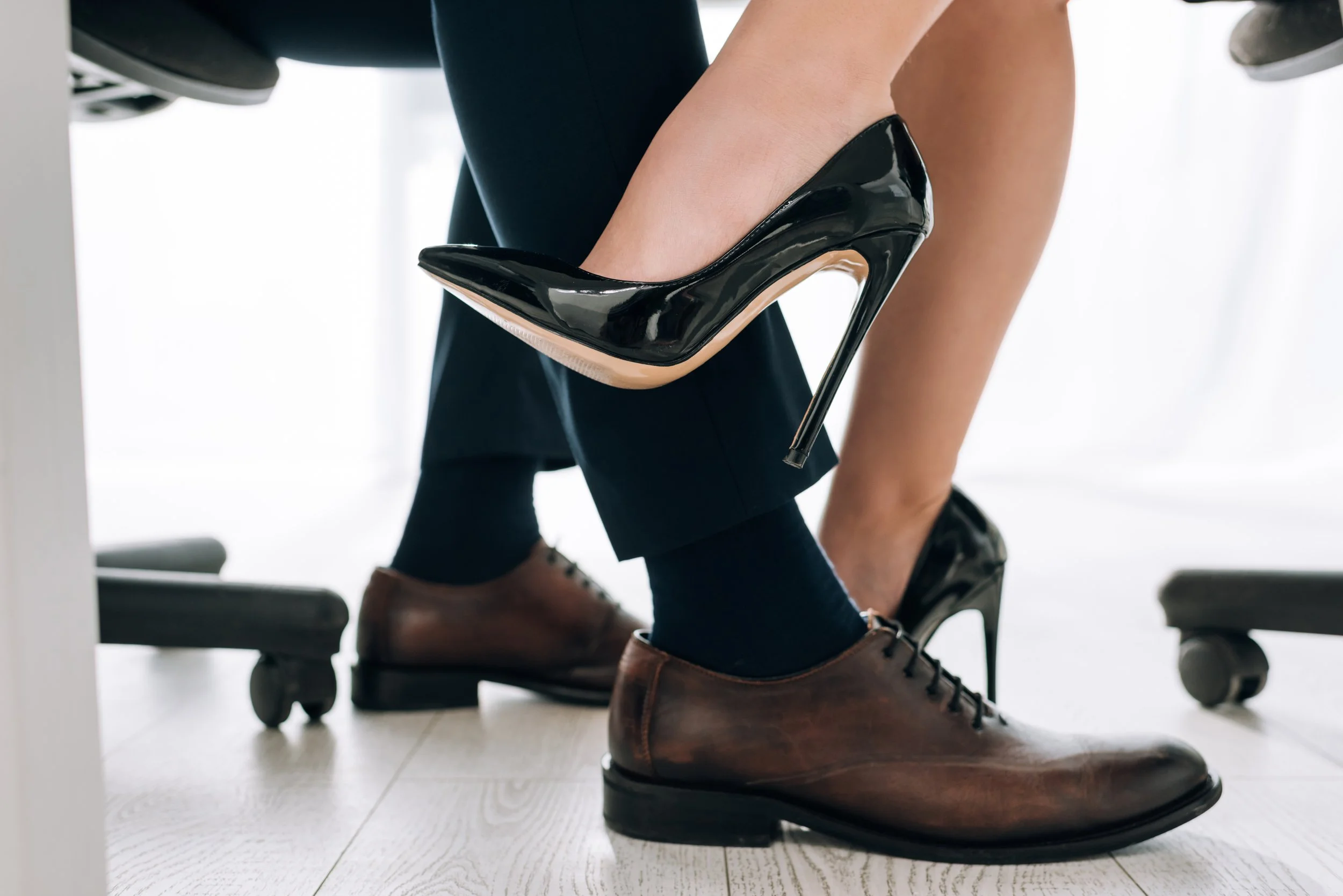 cropped-view-of-secretary-in-heels-touching-leg-of-2024-11-18-19-15-49-utc.jpg