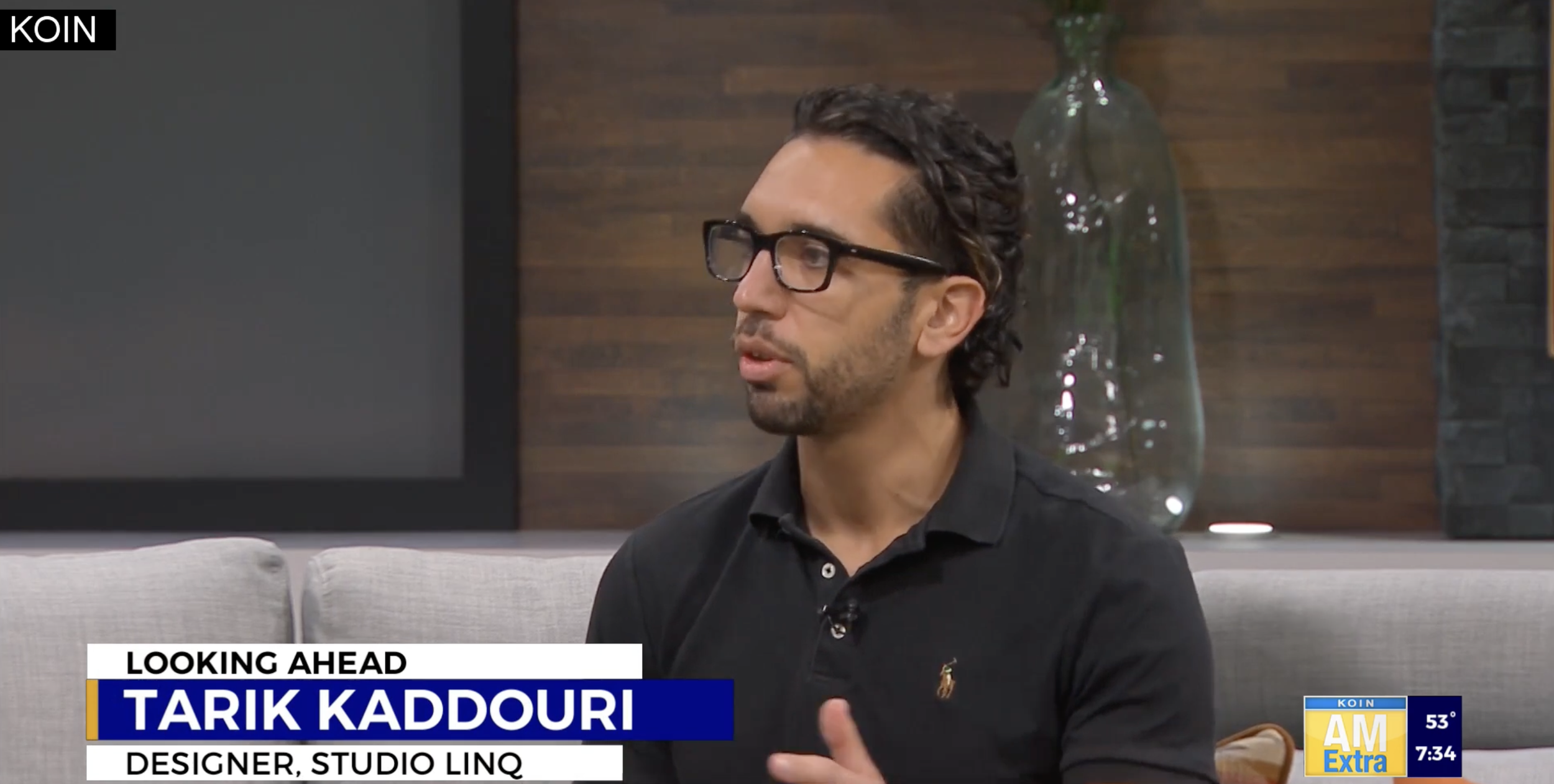 Tarik Kaddouri, a designer from Studio LINQ, speaking during an interview on a television program.