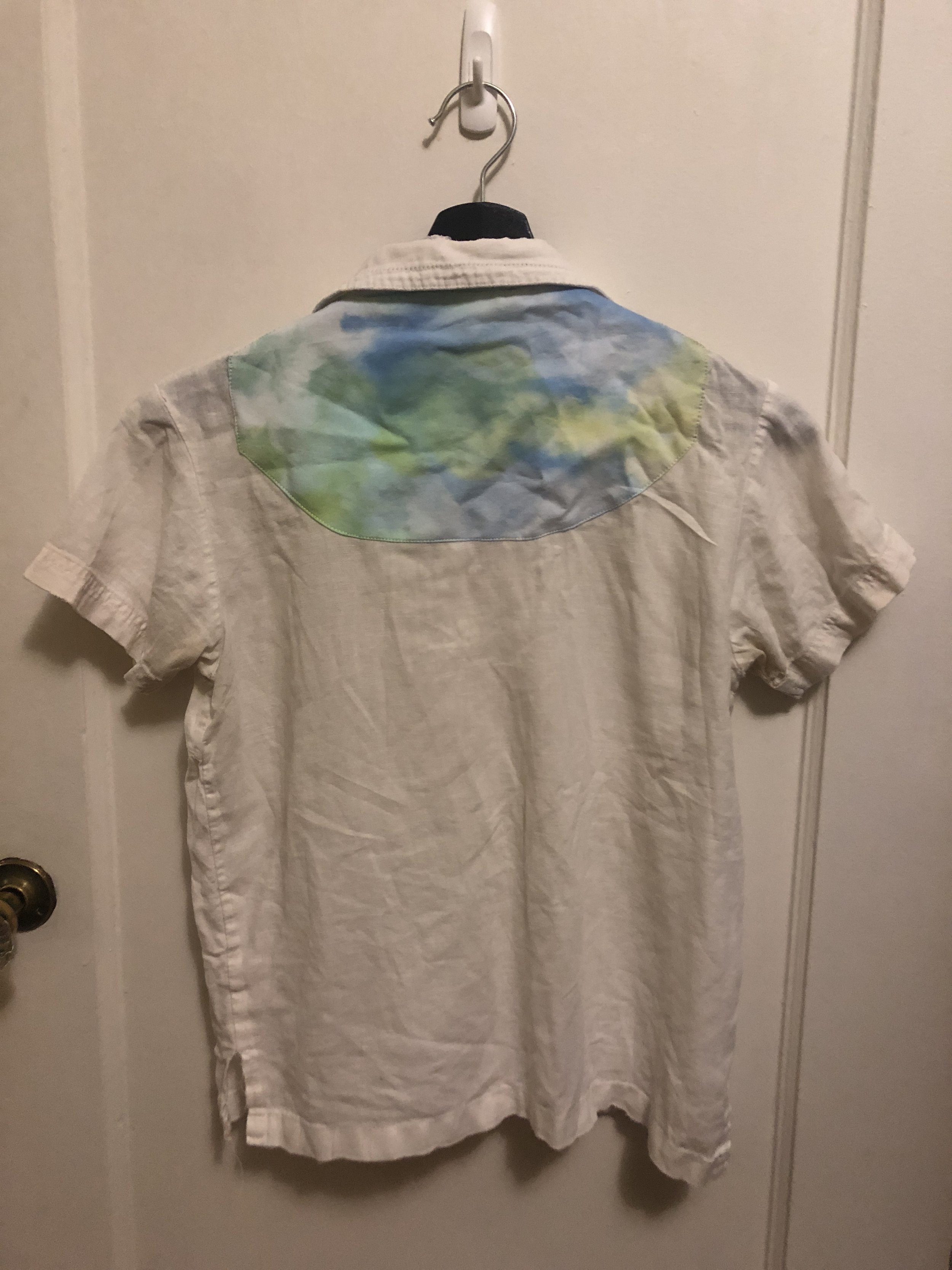 holes from backpack straps - patched with ice dyed fabric