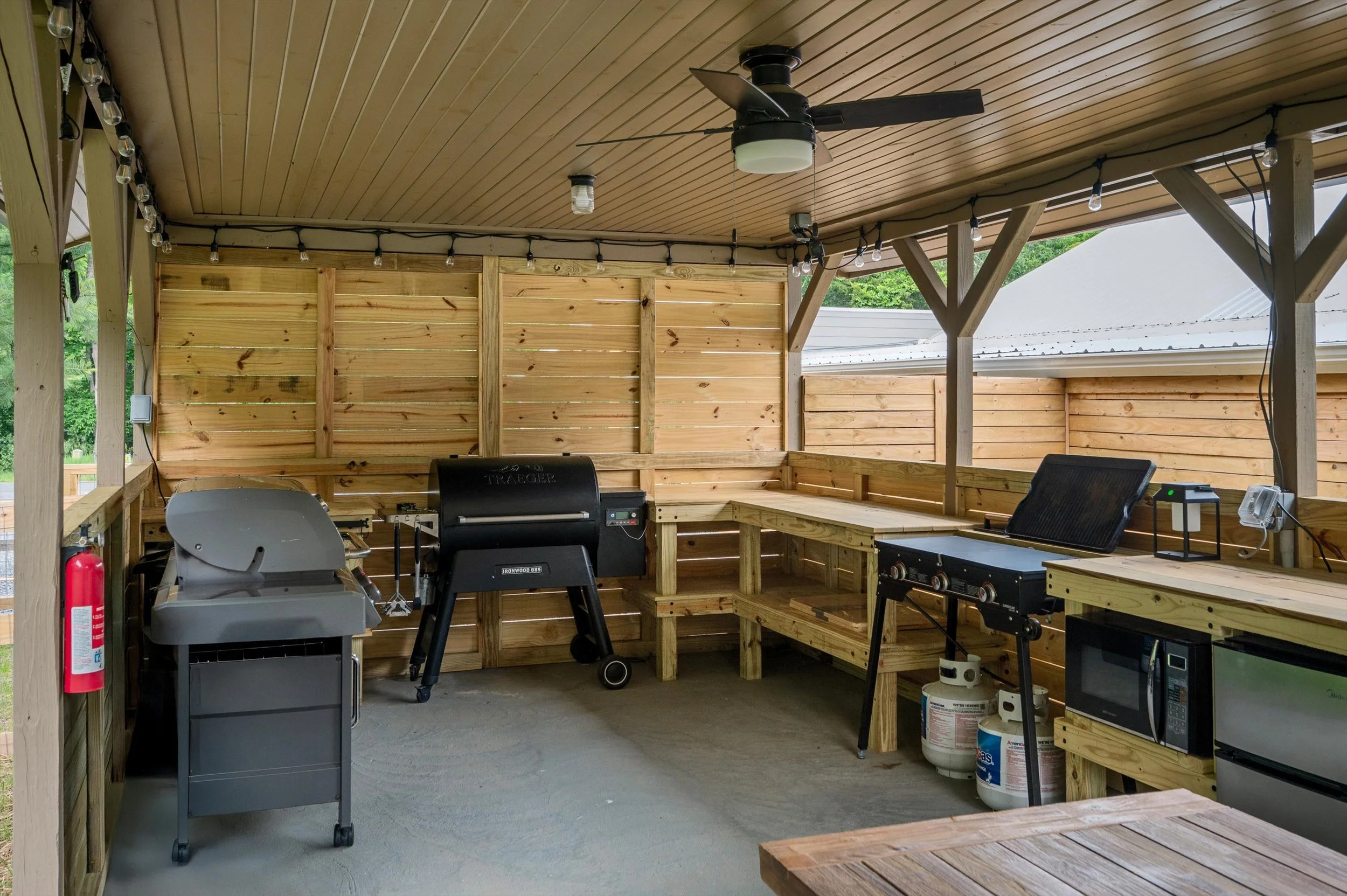 148-exterior, outdoor kitchen with smoker, grill, grittle . web.jpg