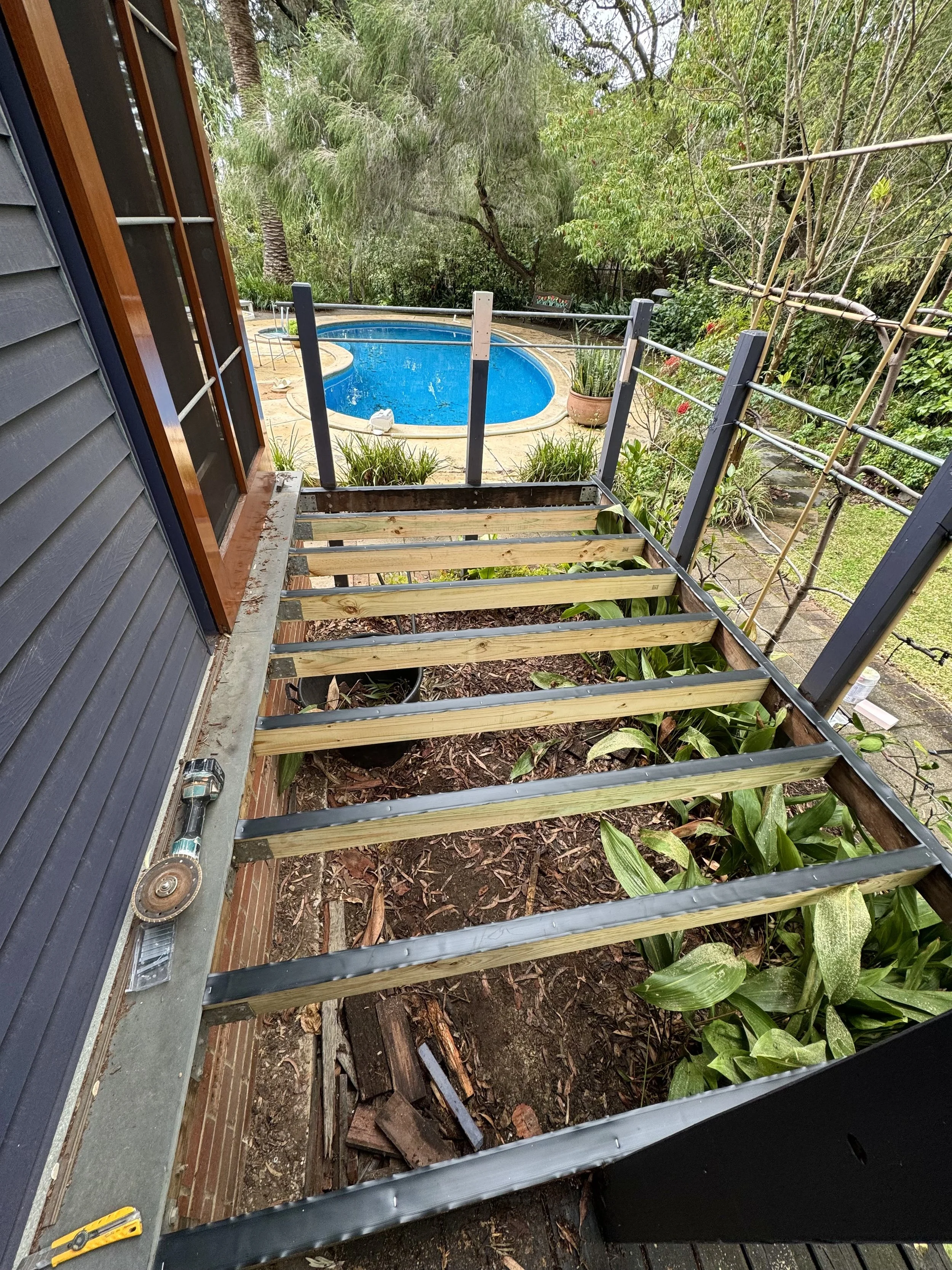 Joist replacement and installation of new Merbau hardwood decking boards.