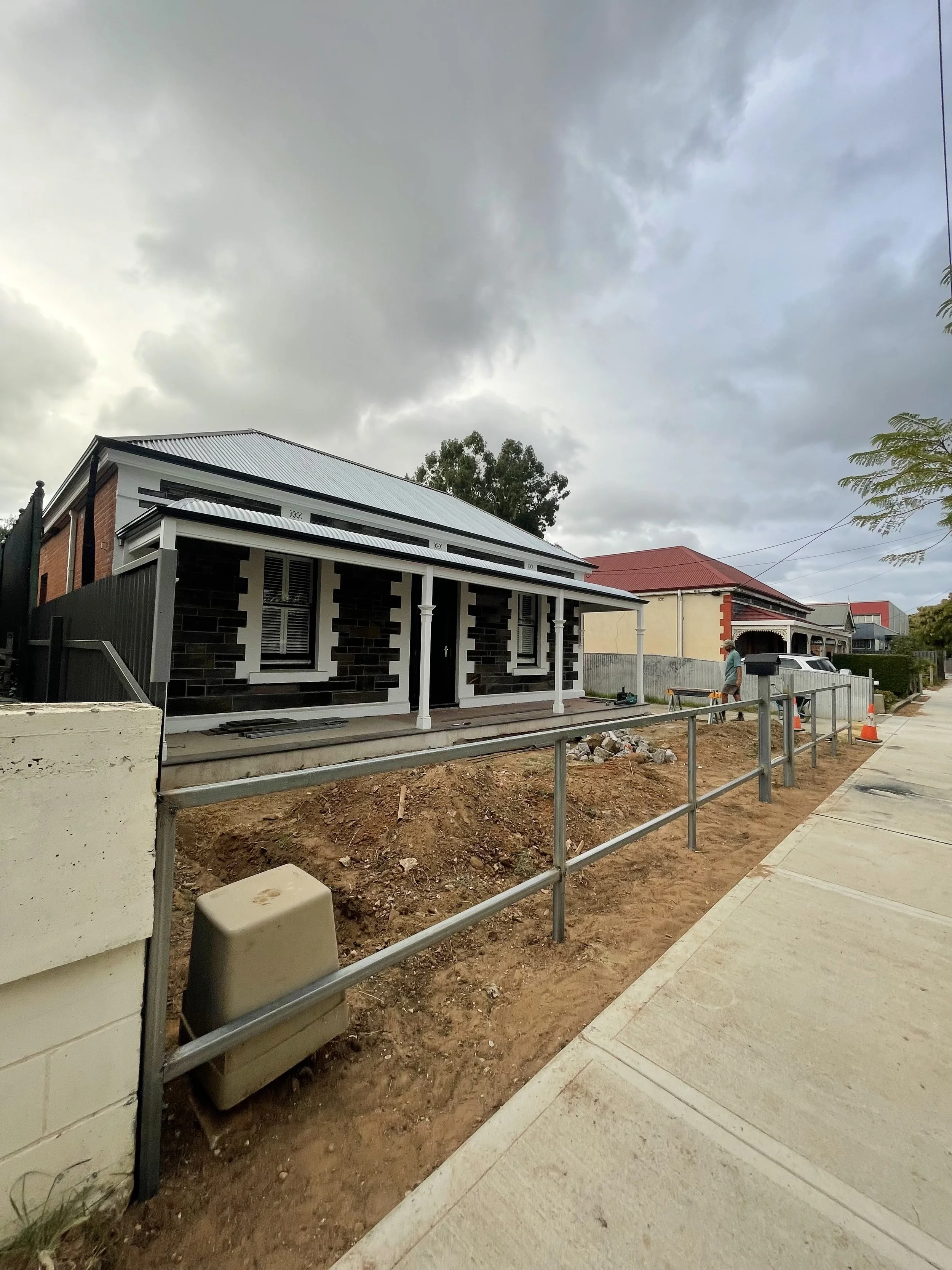 Installation of steel framed fence with 42x42 timber battens.