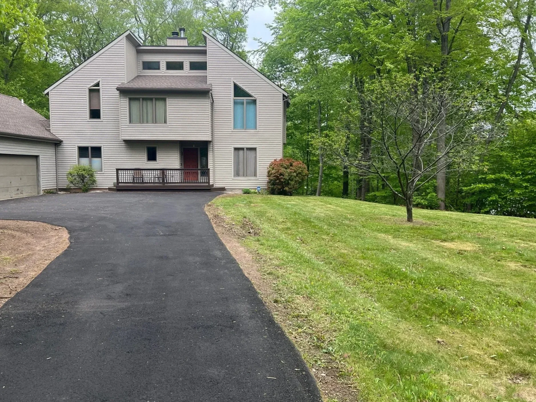 Freshly mowed commercial lawn with clean edge work at managed property in New Haven County CT