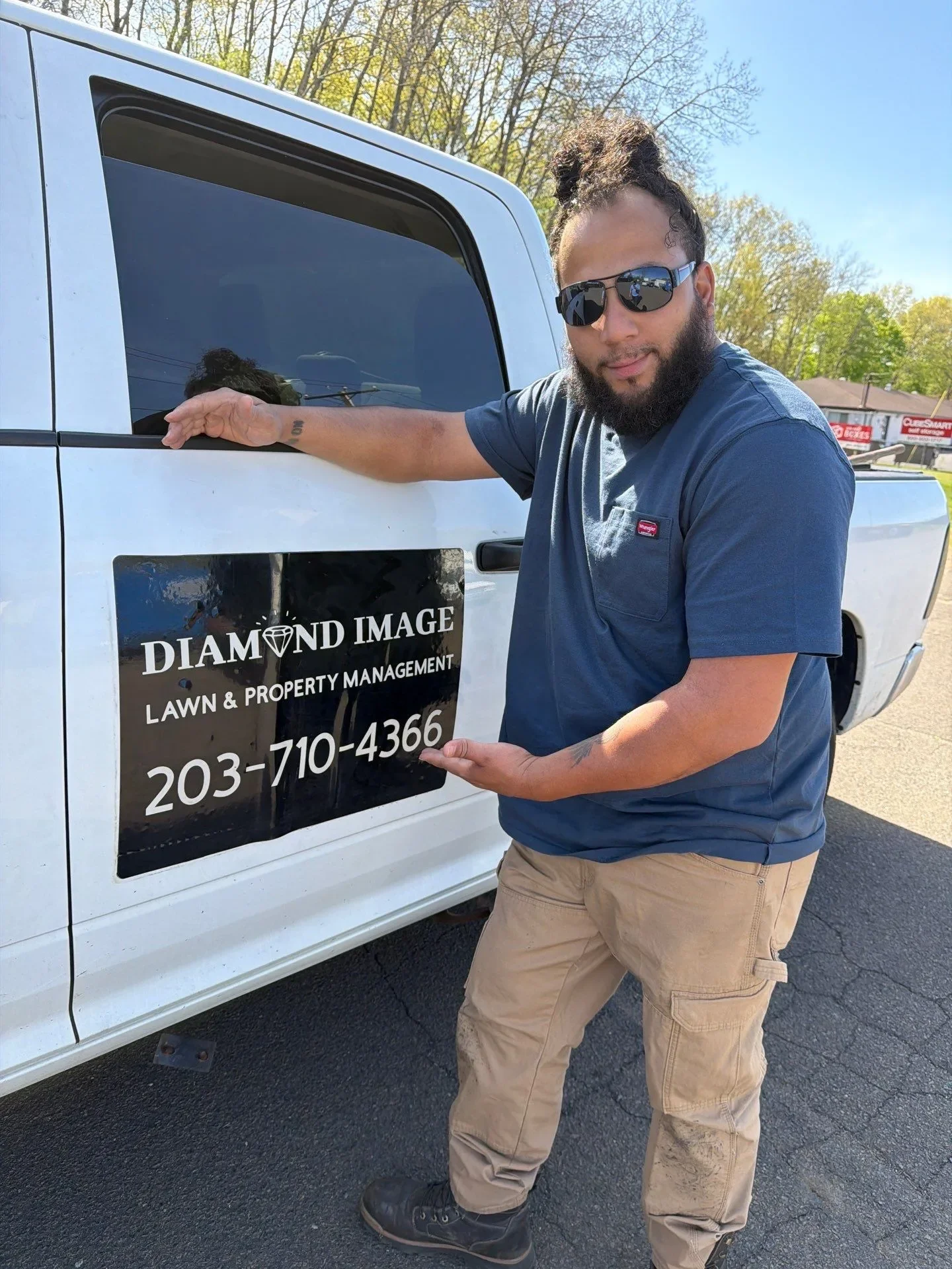 Diamond Image LLC lawn and property management technician on site for scheduled commercial service in New Haven County CT