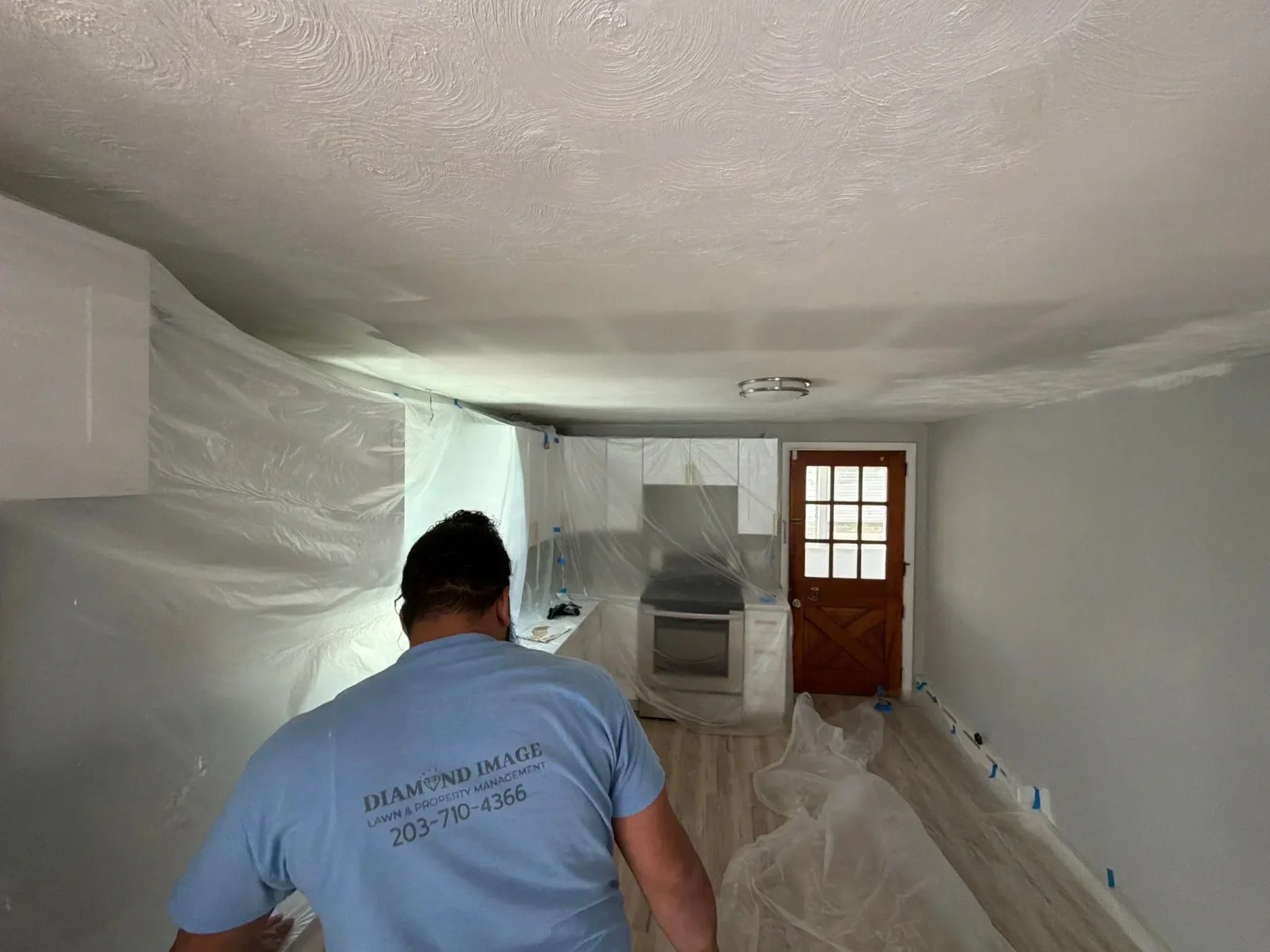 Diamond Image LLC crew member working on home renovation project in Connecticut