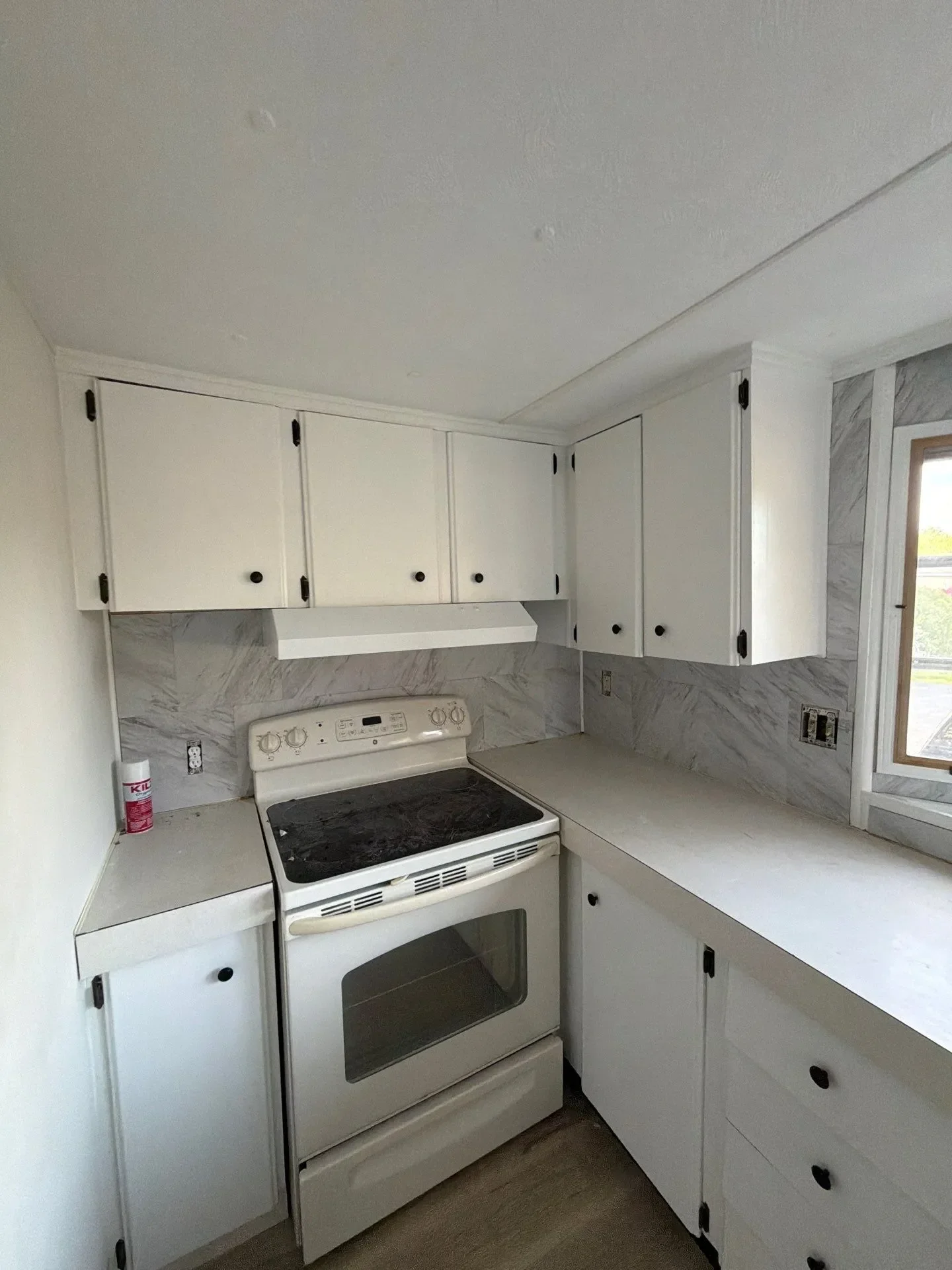 Kitchen remodel in progress with new white shaker cabinets being installed in New Haven County CT