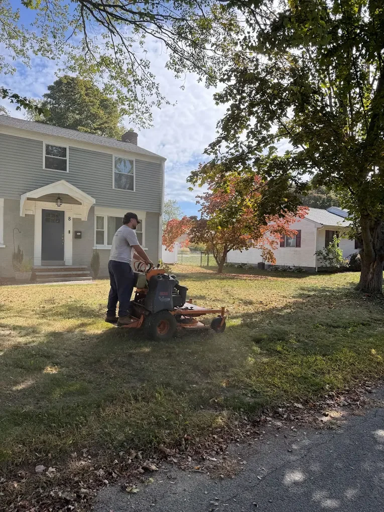 Residential lawn care service, expert technician using commercial-grade zero-turn equipment to keep your yard clean, even, and well-maintained all season long.