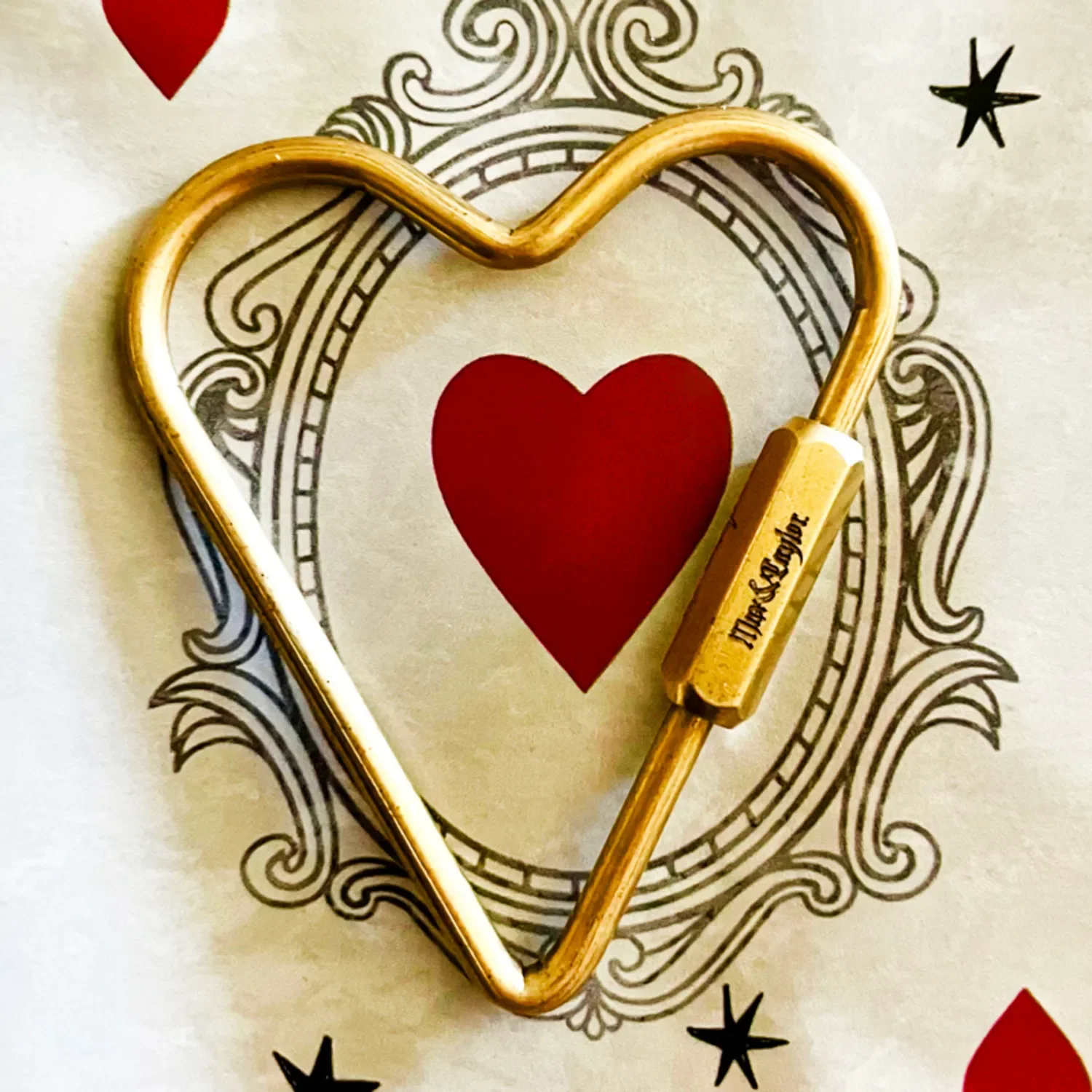 Perfect personalized gift for your girl with both your names engraved on brass heart carabiner keychain.