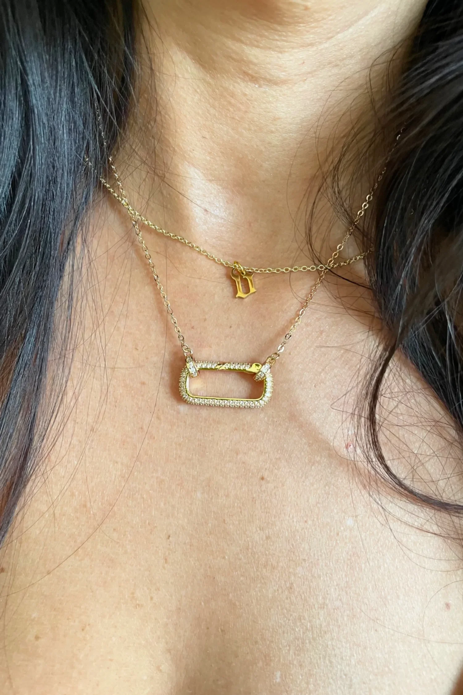 women wearing layered gold necklaces by Babe's Hardware