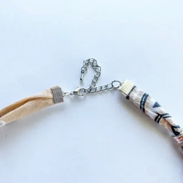 Close-up of Blush Bandana Charm Necklace silver lobster clasp and adjustable extension chain — silver crimp end caps