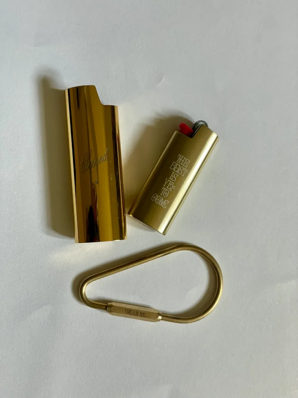 Personalized everyday carry brass teardrop carabiner keyring, mirror gold Bic lighter case and brushed bronze mini bic lighter case