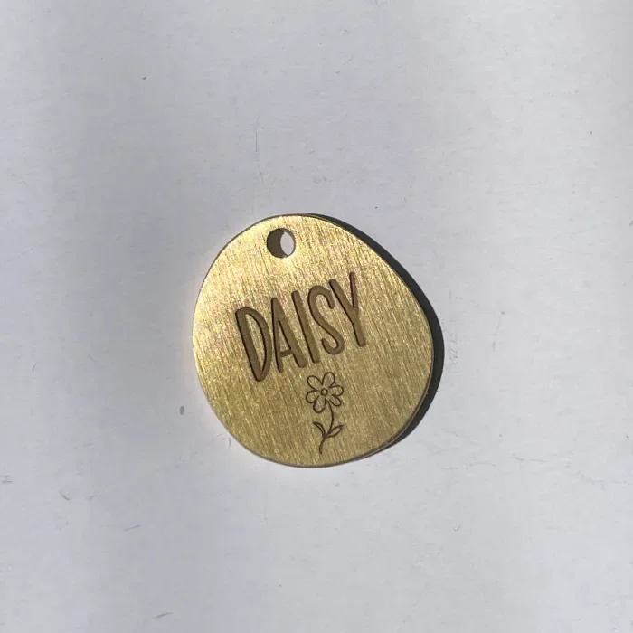 Engraved brass name tag with flower