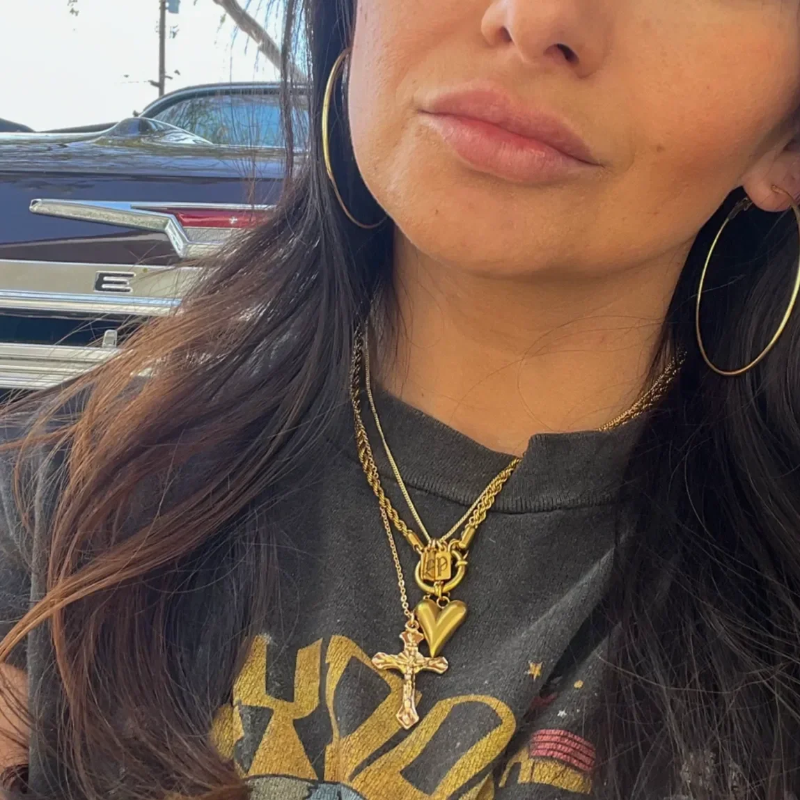 Women wearing layered gold necklaces by Babe's Hardware