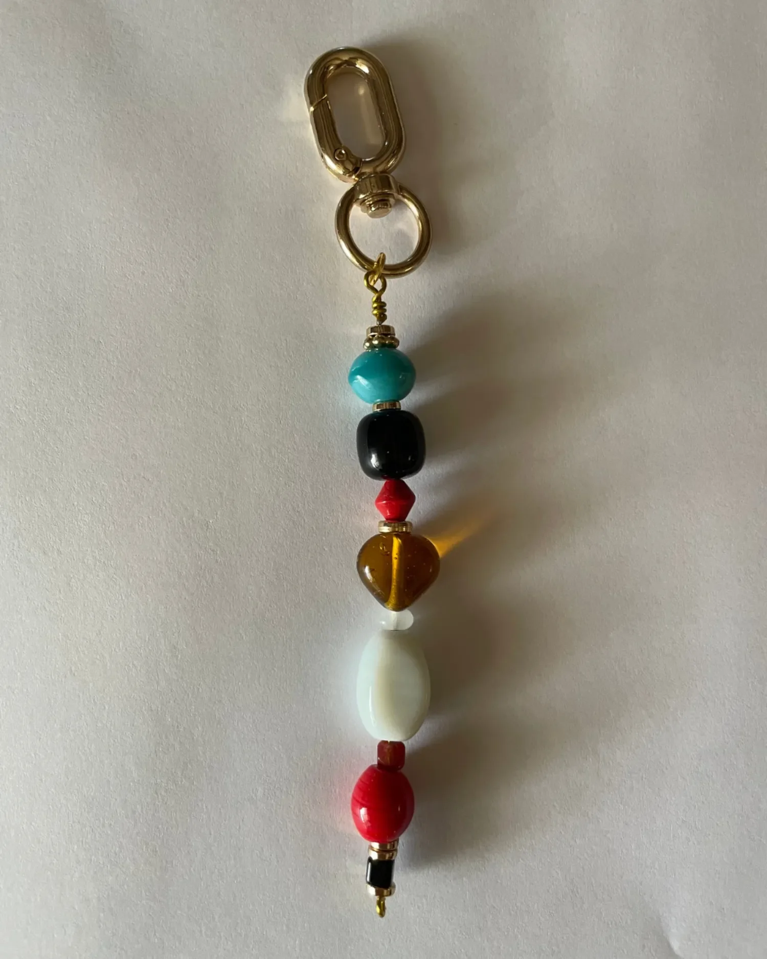 Multi-colored beaded strand bag charm by Babe's Hardware