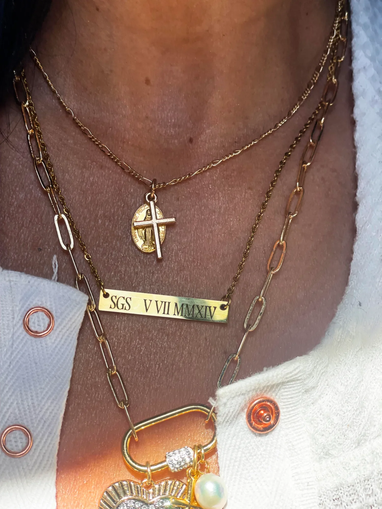 Detailed view of engraved gold bar pendant on fine chain, showing precise custom etching and 14k gold plated finish.