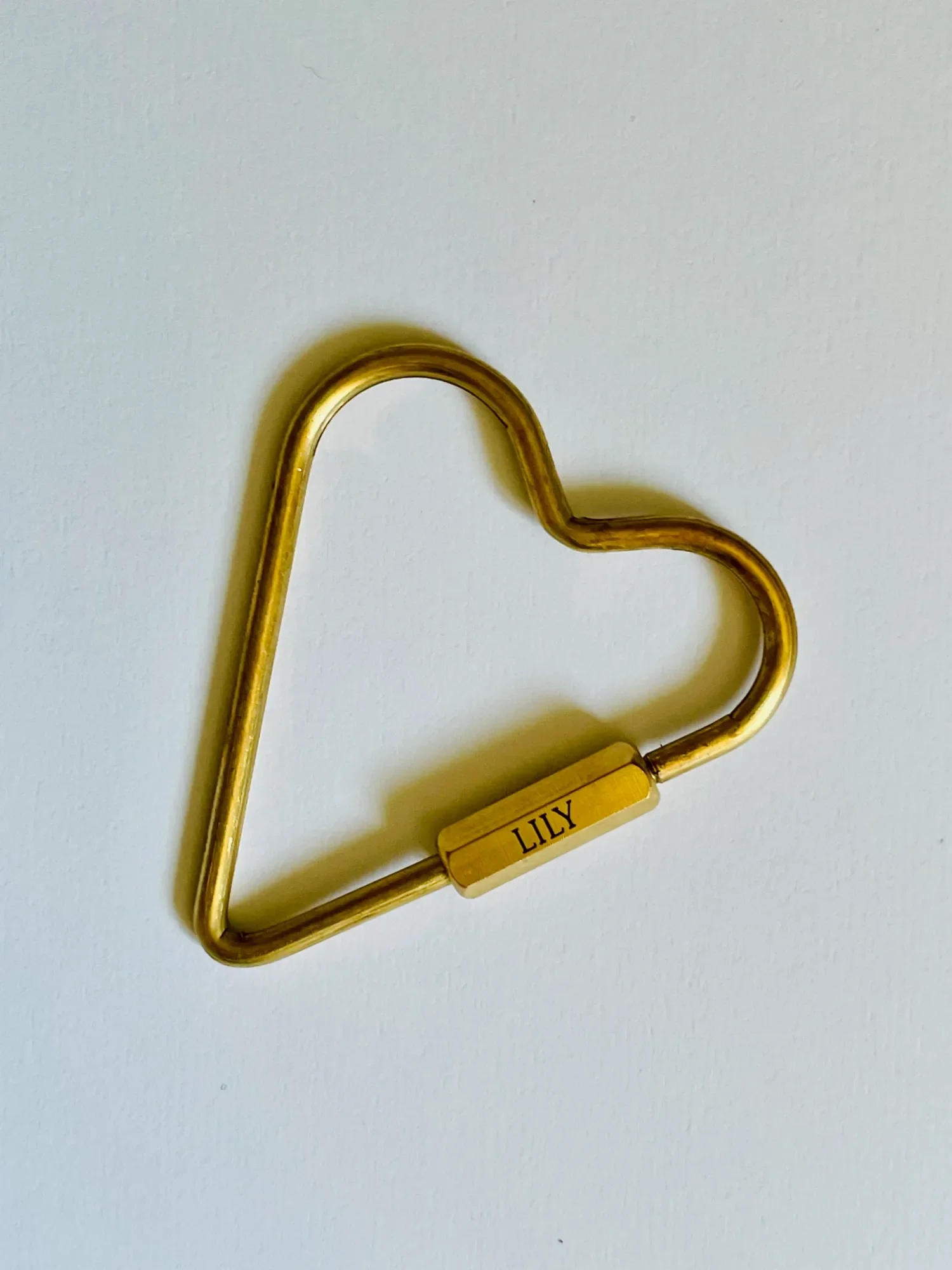Engraved brass heart carabiner keychain with personalized name “LILY” on hex lock