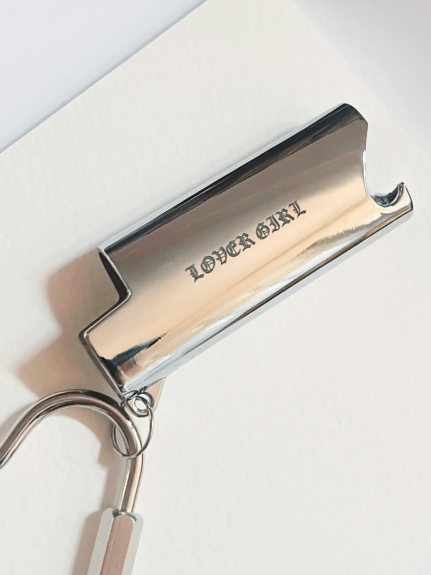 Custom Engraved 'LOVERGIRL' in Blackletter font on mini chrome bic lighter case by Babes Hardware