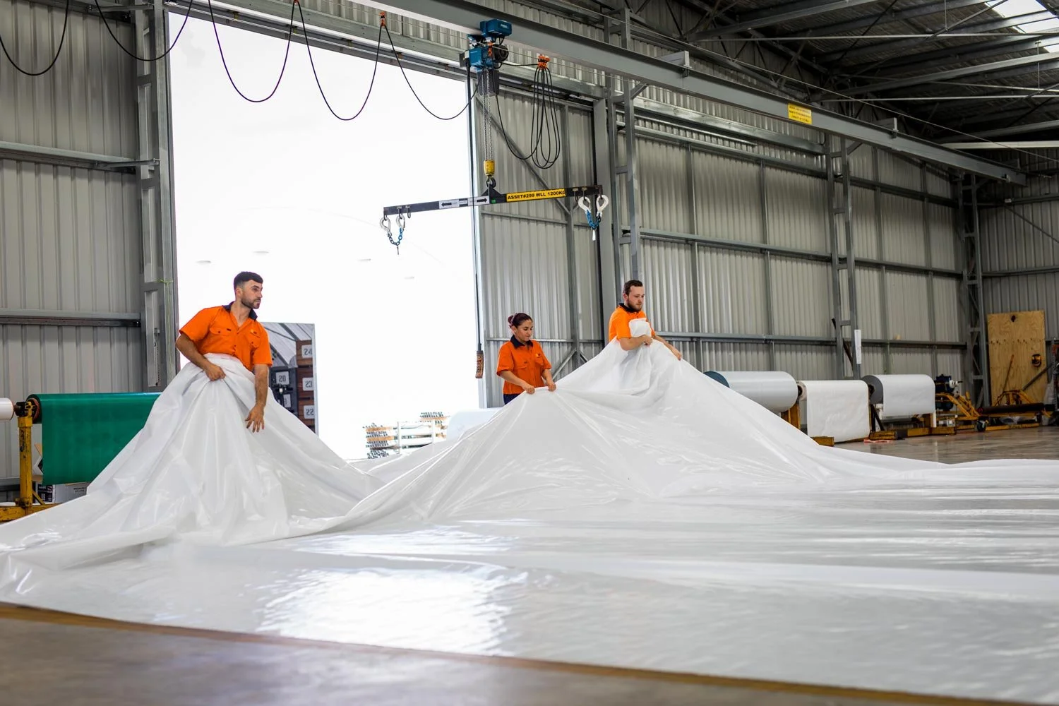 rolling-a-white-tarpaulin.jpg
