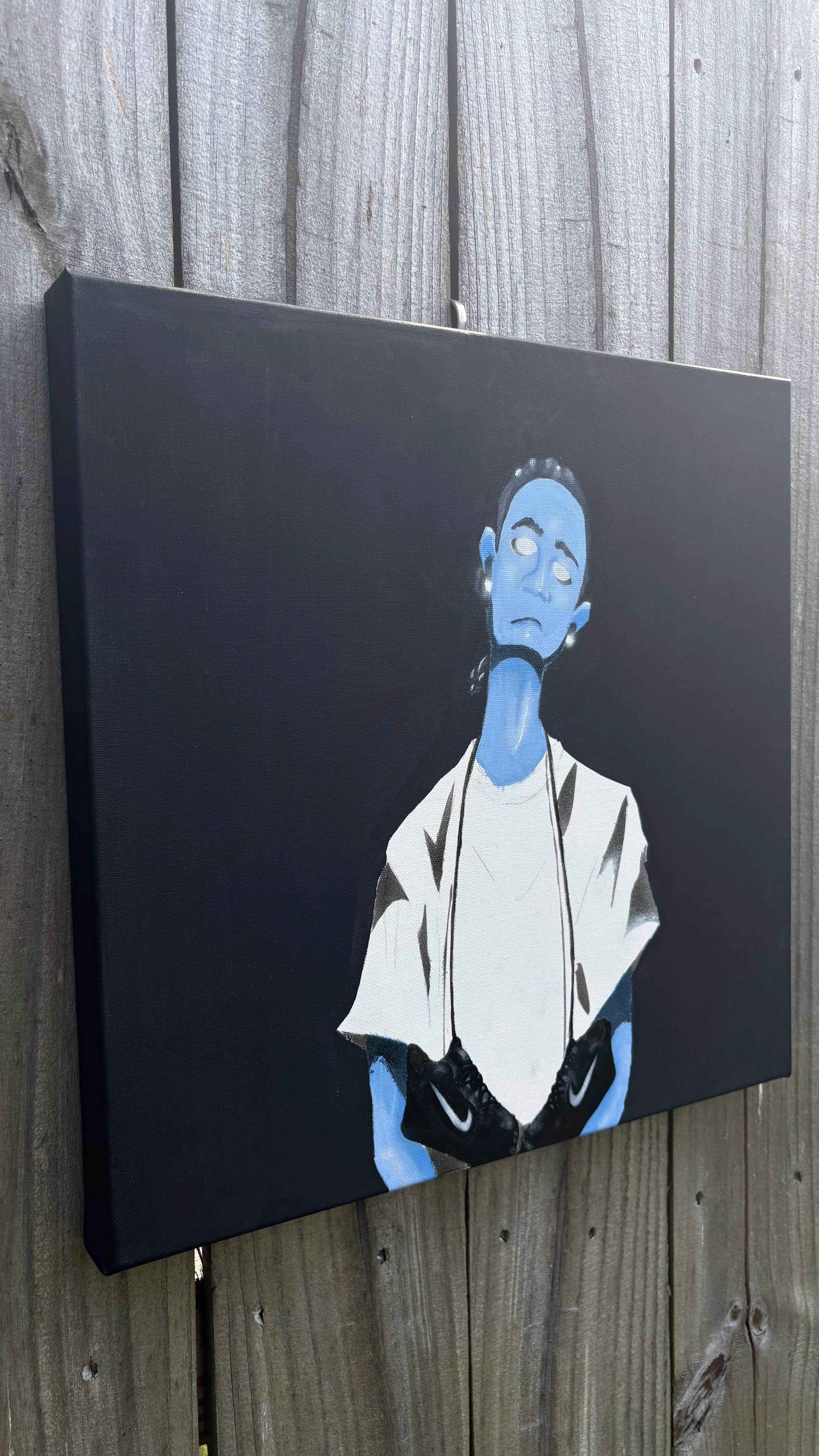 Painting of a woman with blue skin, wearing white clothing and a sneaker necklace, against a black background.
