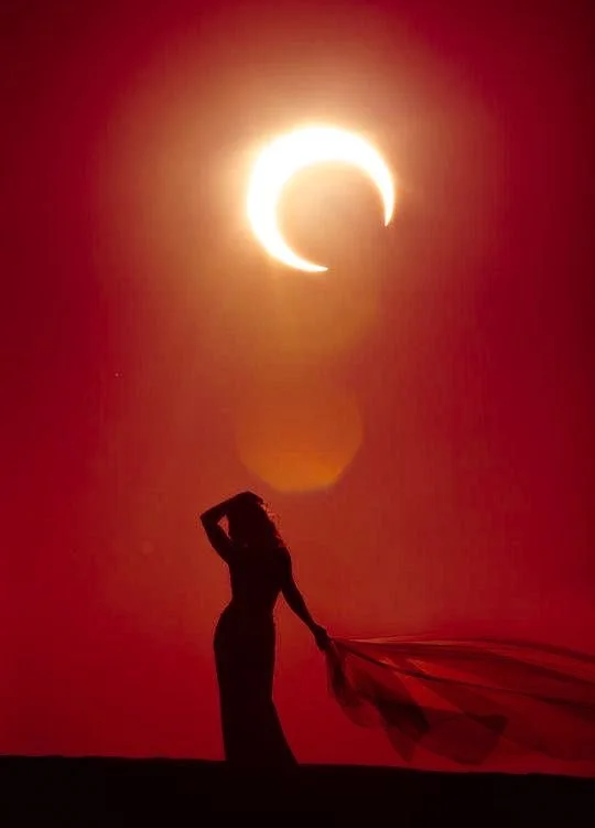 Digital artwork of two glowing, stylized fish with a starry background, crescent moons, and astrological symbols, featuring blue and green luminescent colors.