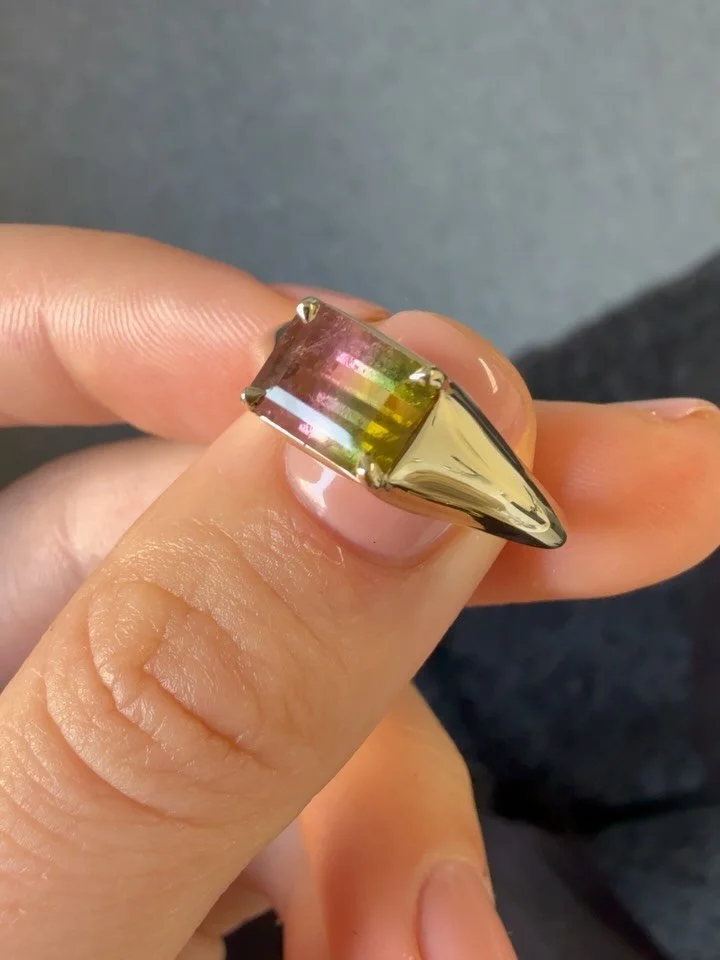 a watermelon tourm so gorgeous she could be edible, set with tiny gold claws