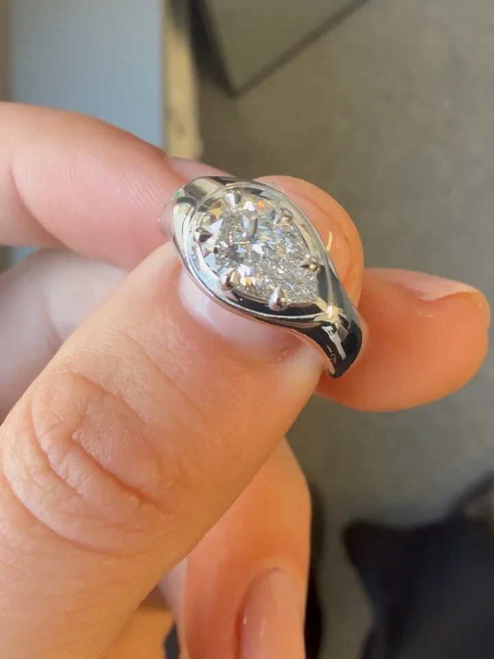 East-west pear cut diamond with a hidden emerald for Ava