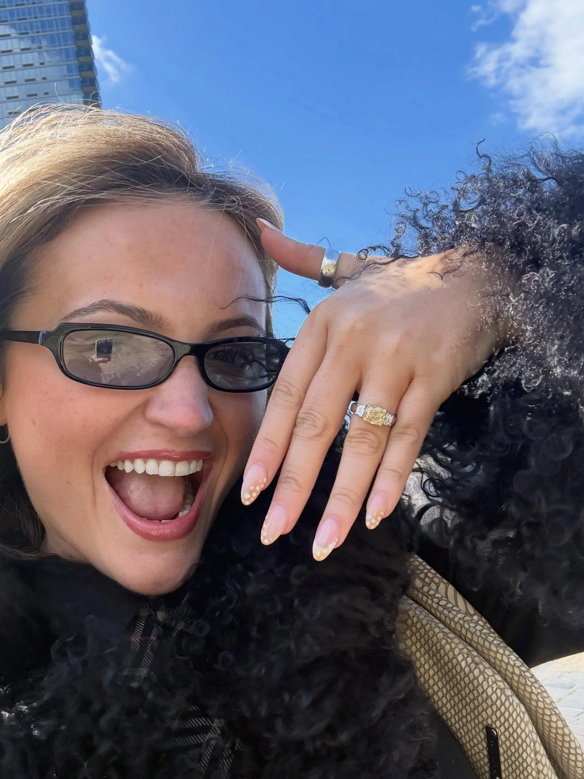 I love these pics so much !! 🥹🍎 Liam &amp; Laura engaged in New York with the most mega yellow &amp; white diamond ring. Liam &amp; I worked closely together on this one, we chose a big cushion centre stone flanked by white diamond trapezoids, set 