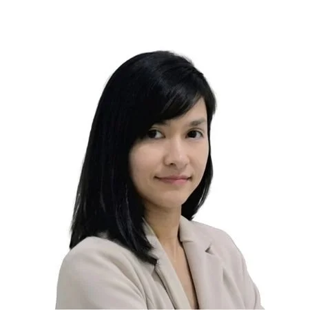 A woman with a long black hair wearing a white coat