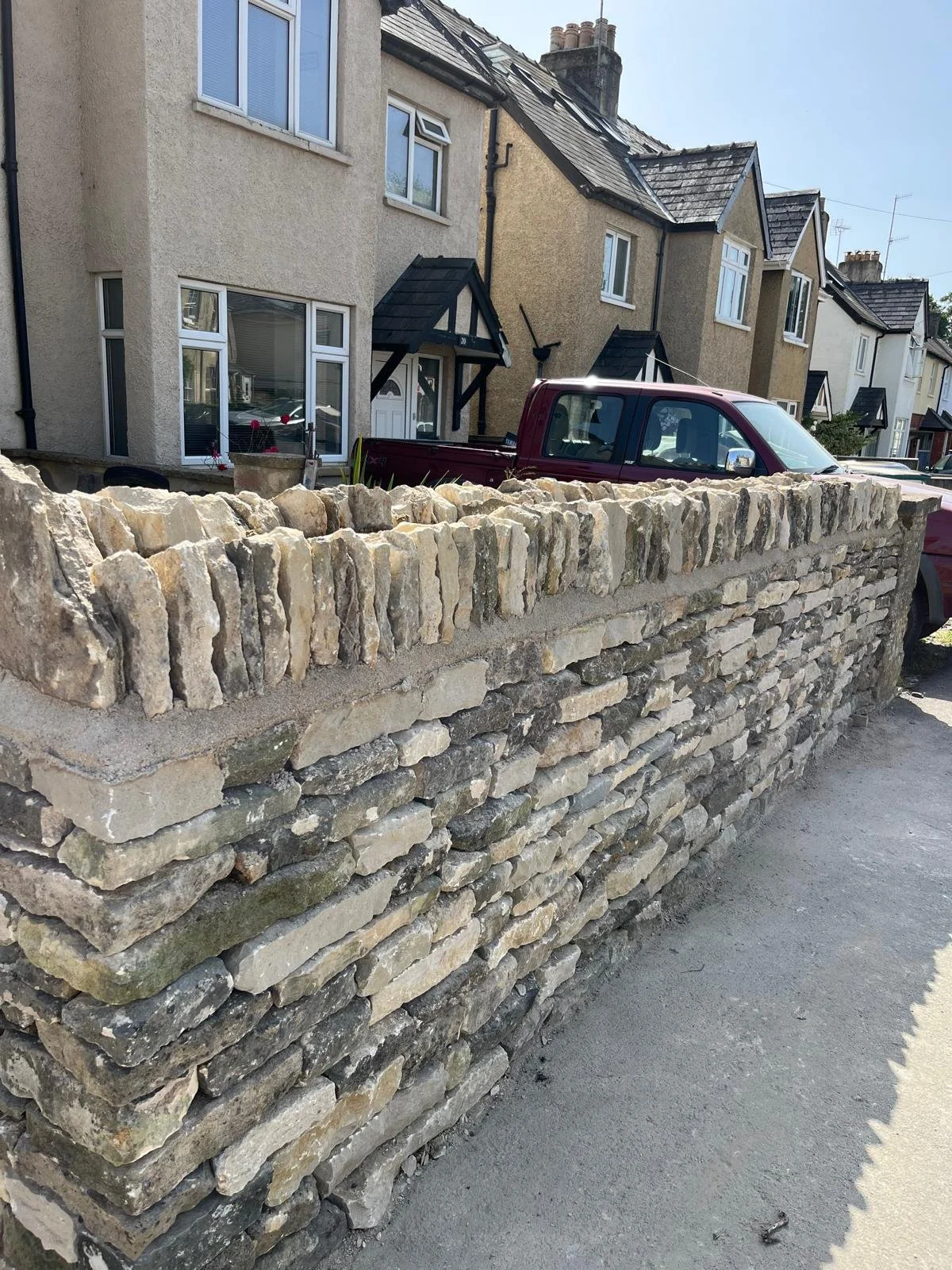 Close-up of high-quality dry stone walling craftsmanship in Cirencester