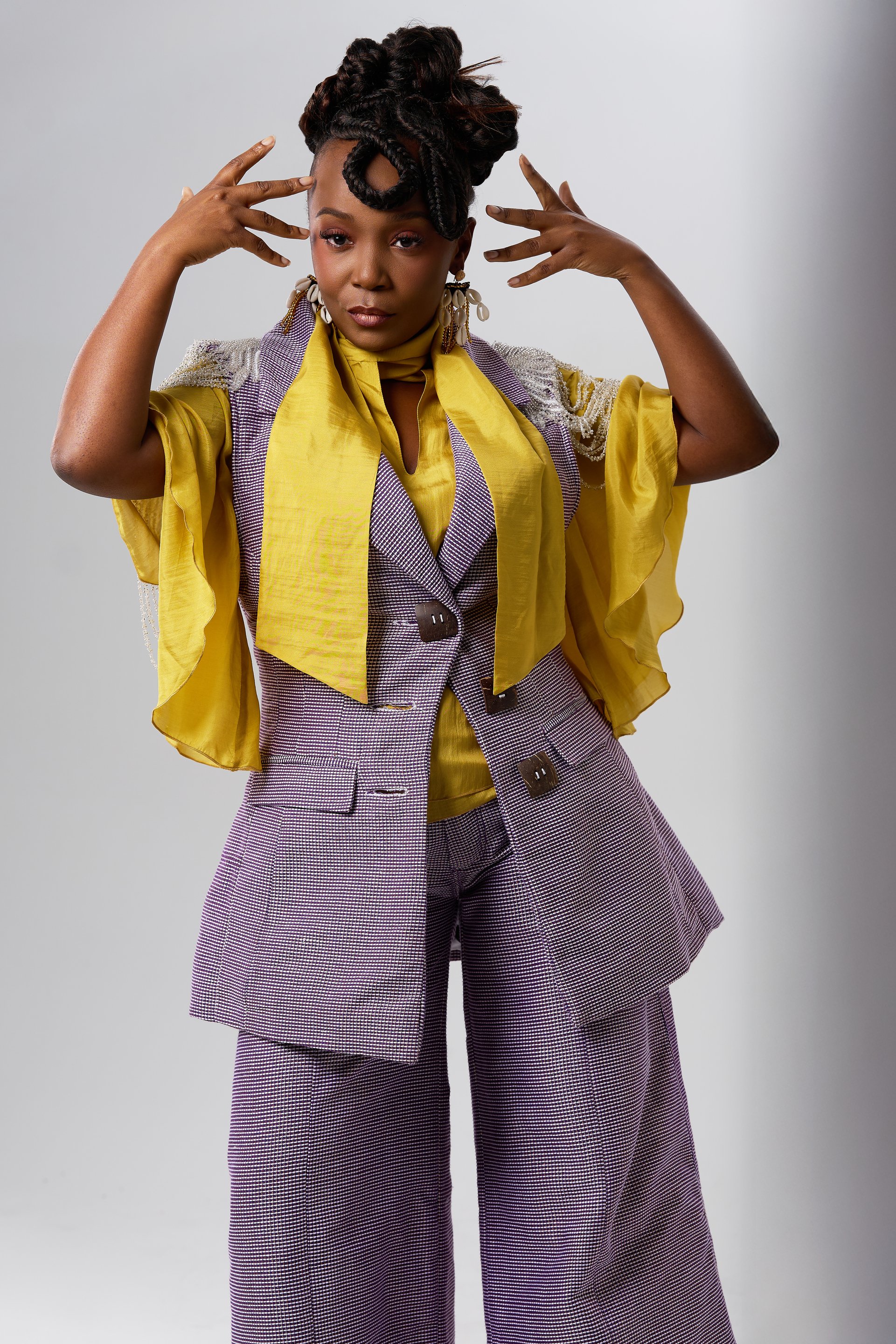  NYNY RYKE founder Fallylah Nyny Ryke Goungou with handwoven textiles NYNY RYKE sustainable luxury collection Togo Italy craftsmanship AIDA Award winner NYNY RYKE sustainable fashion brand Nyasha Michelle wearing NYNY RYKE Issue 10 cover feature 