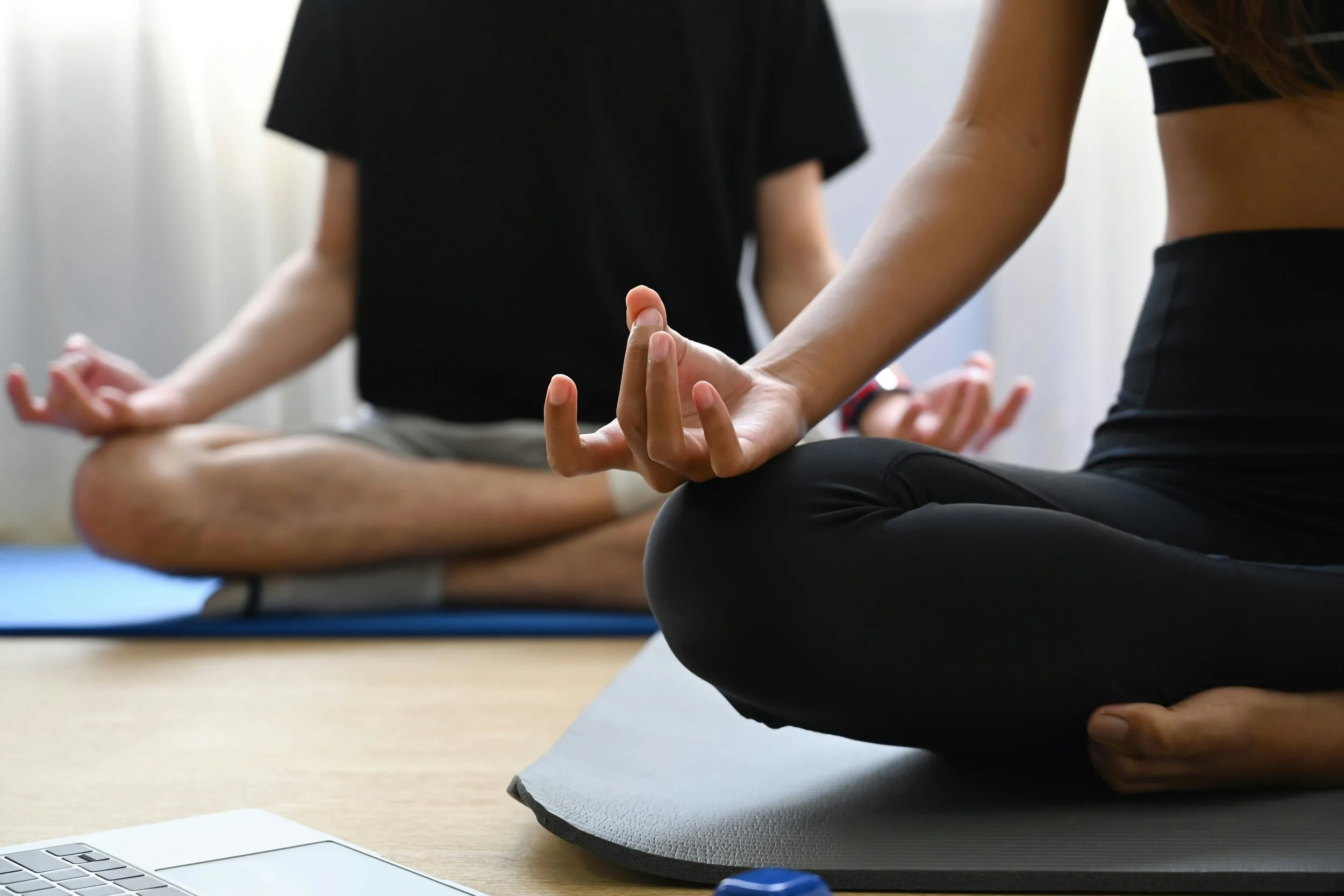 two people doing yoga