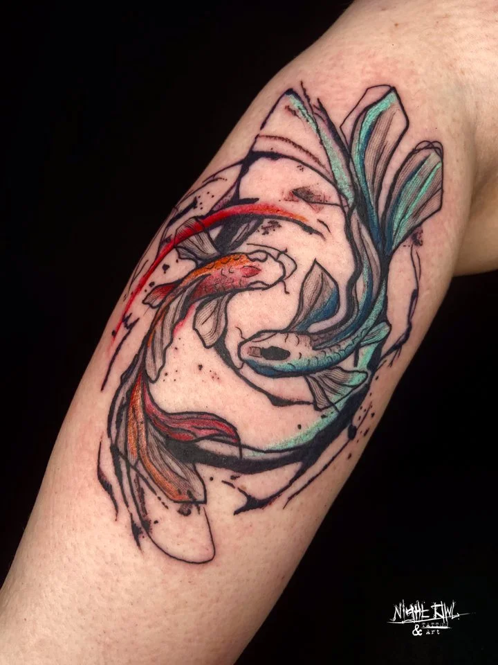 Color tattoo of two koi fish swimming together