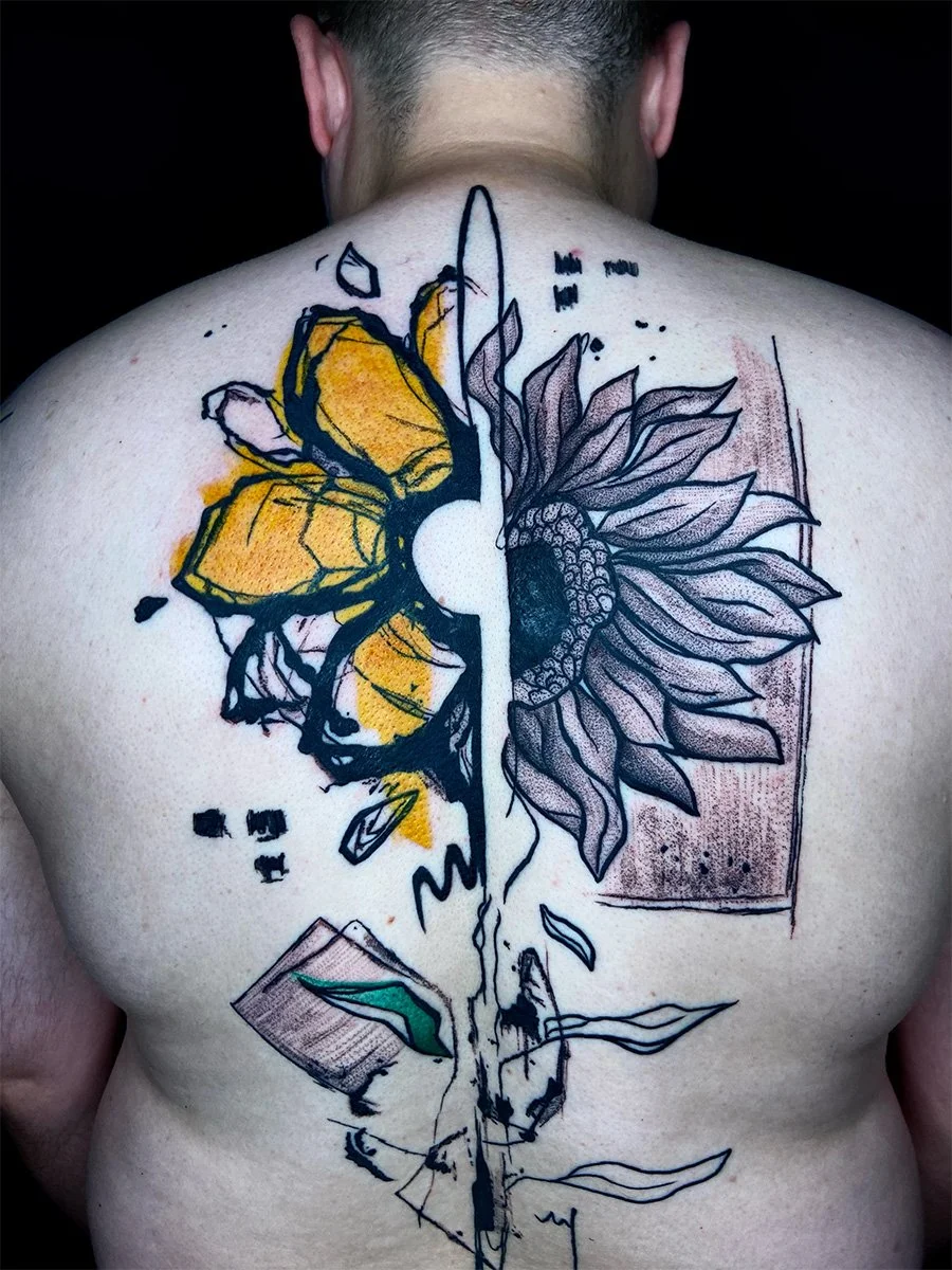 Abstract sunflower tattoo on back