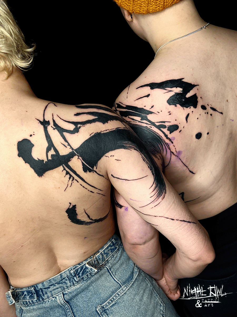 Abstract brushstroke couple tattoo