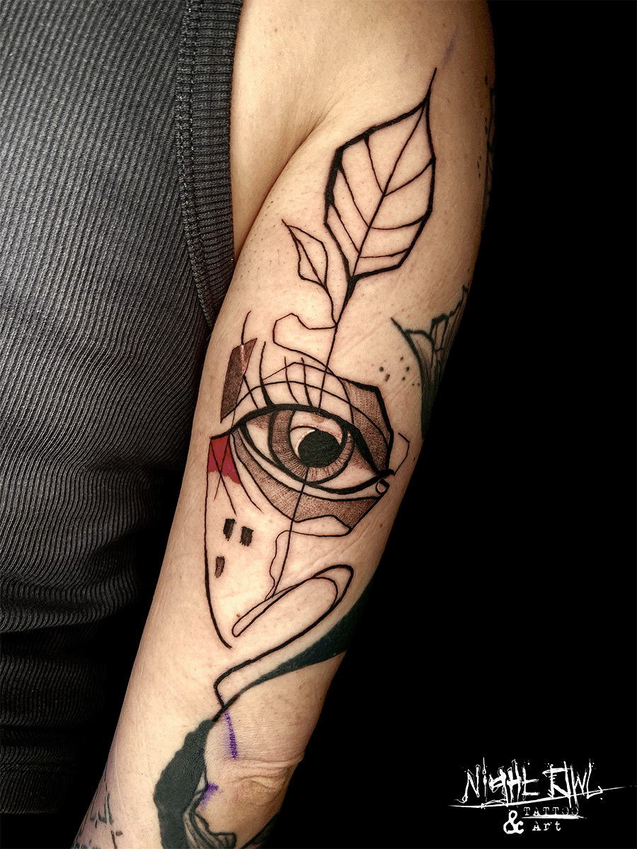Abstract contemporary eye and leaf tattoo