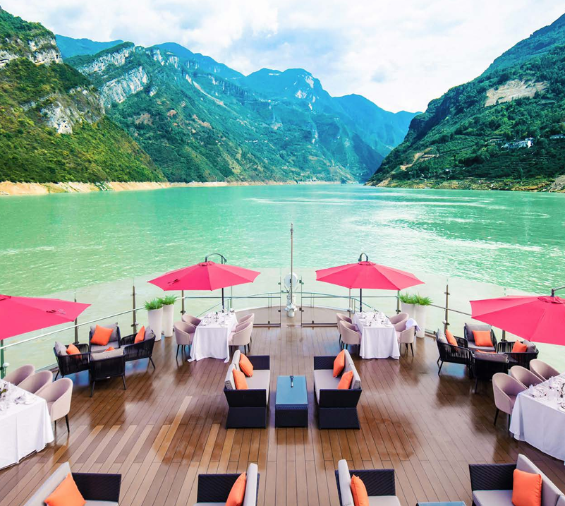 Forward deck view of the Yangtze River and surrounding mountains