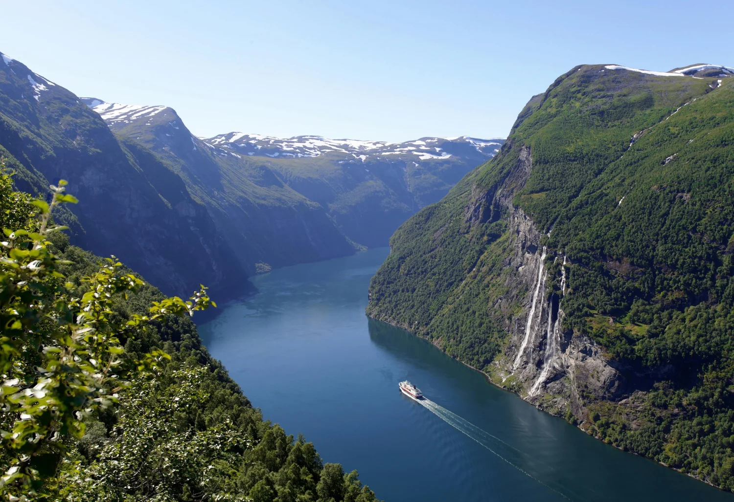 Waterfall cascading down the steep walls of Geirangerfjord in Norway