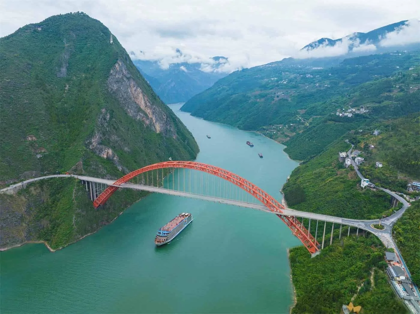 Century Cruises ship sailing beneath a bridge in the Yangtze River region