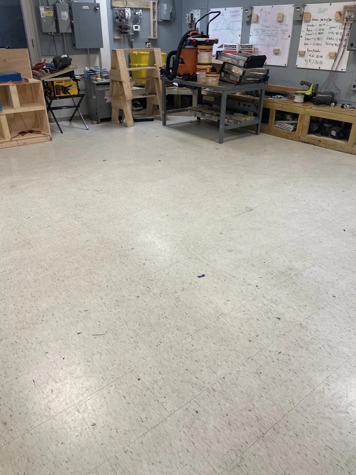 Floor-restoration preparation in an HVAC training lab at a Brandon college. Abundance of Sunshine Inc. moved the furniture and lab equipment, stripped the old wax, and thoroughly scrubbed the flooring before resealing and applying a new wax finish.