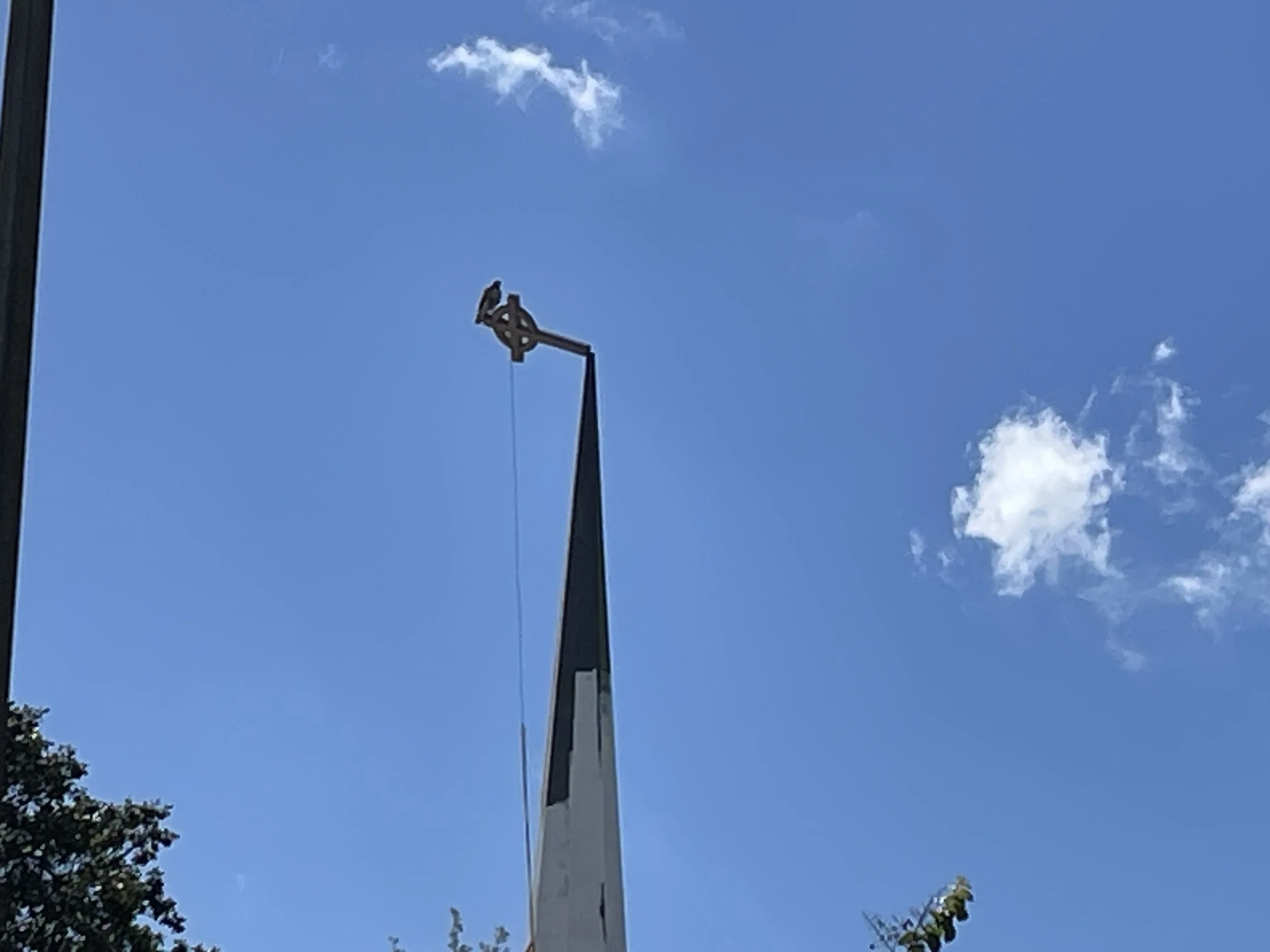 Post-hurricane steeple repair at the Korean Presbyterian Church of Tampa by Abundance of Sunshine Inc., including roof and flashing repairs and restoration of the lightning rod and related electrical components.