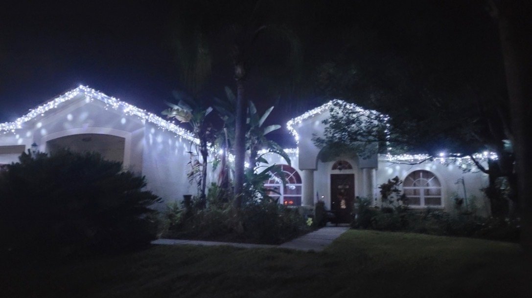 Christmas lighting installed by Abundance of Sunshine Inc. at a Valrico, Florida home after exterior pressure washing and repairs to sprinkler heads and electrical outlets.